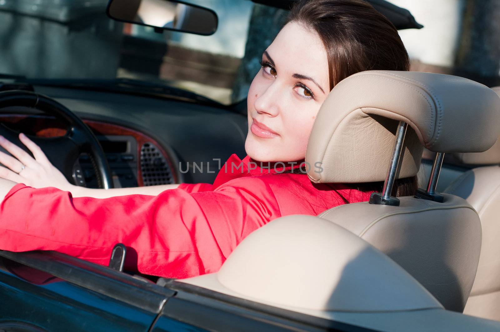 Shot of beautiful brunette woman in car