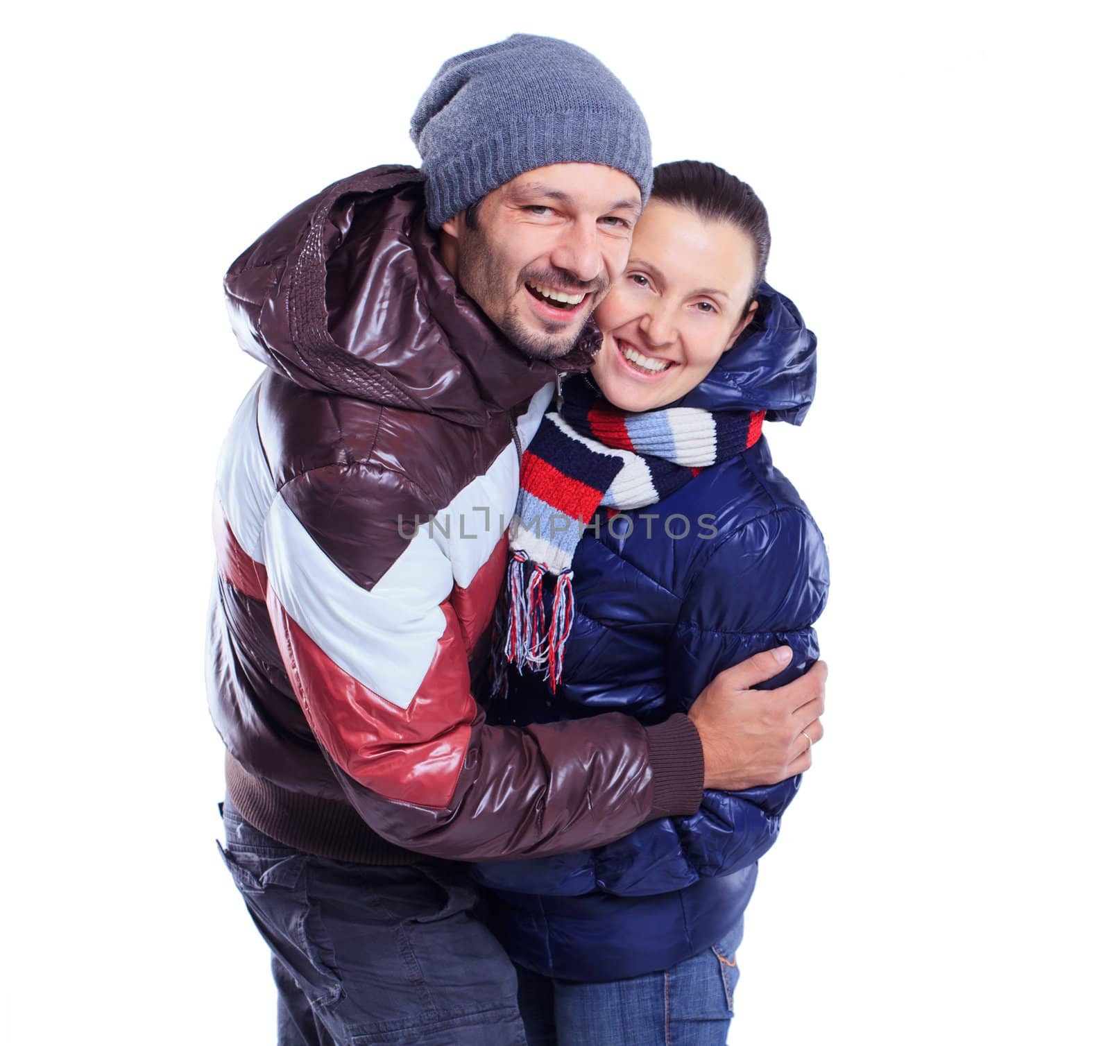 young couple dressed in winter clothes by maxoliki