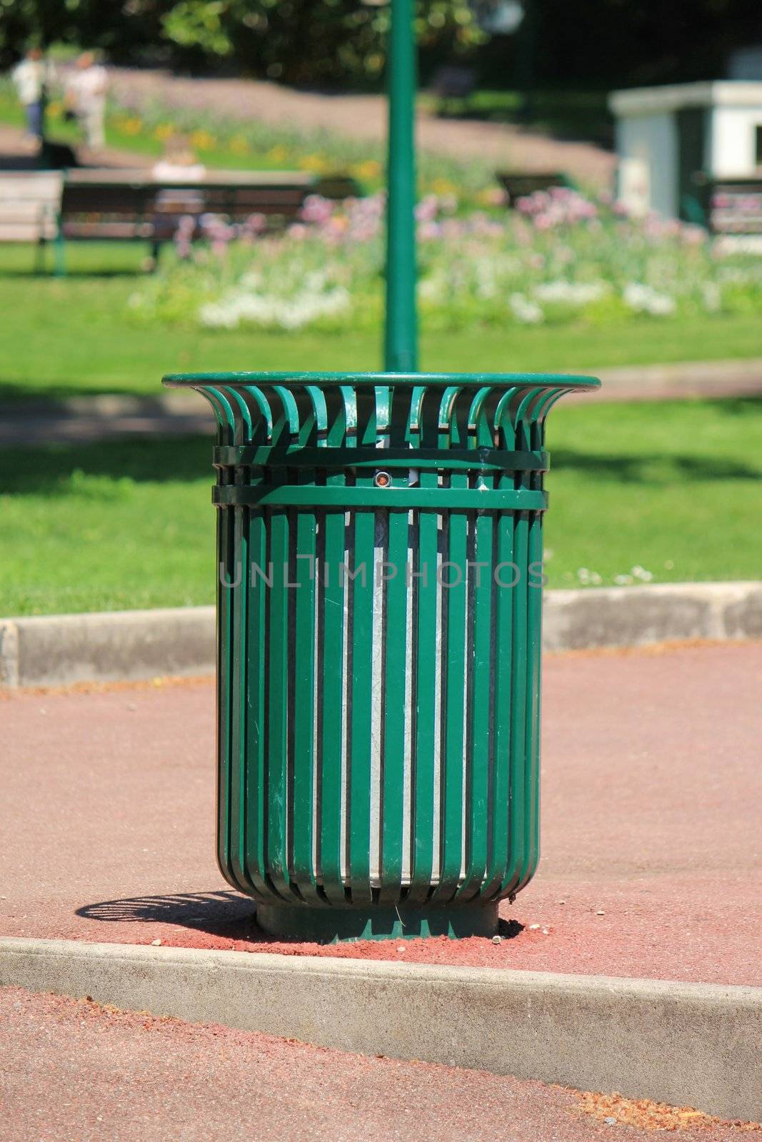 Green wastebin in a park