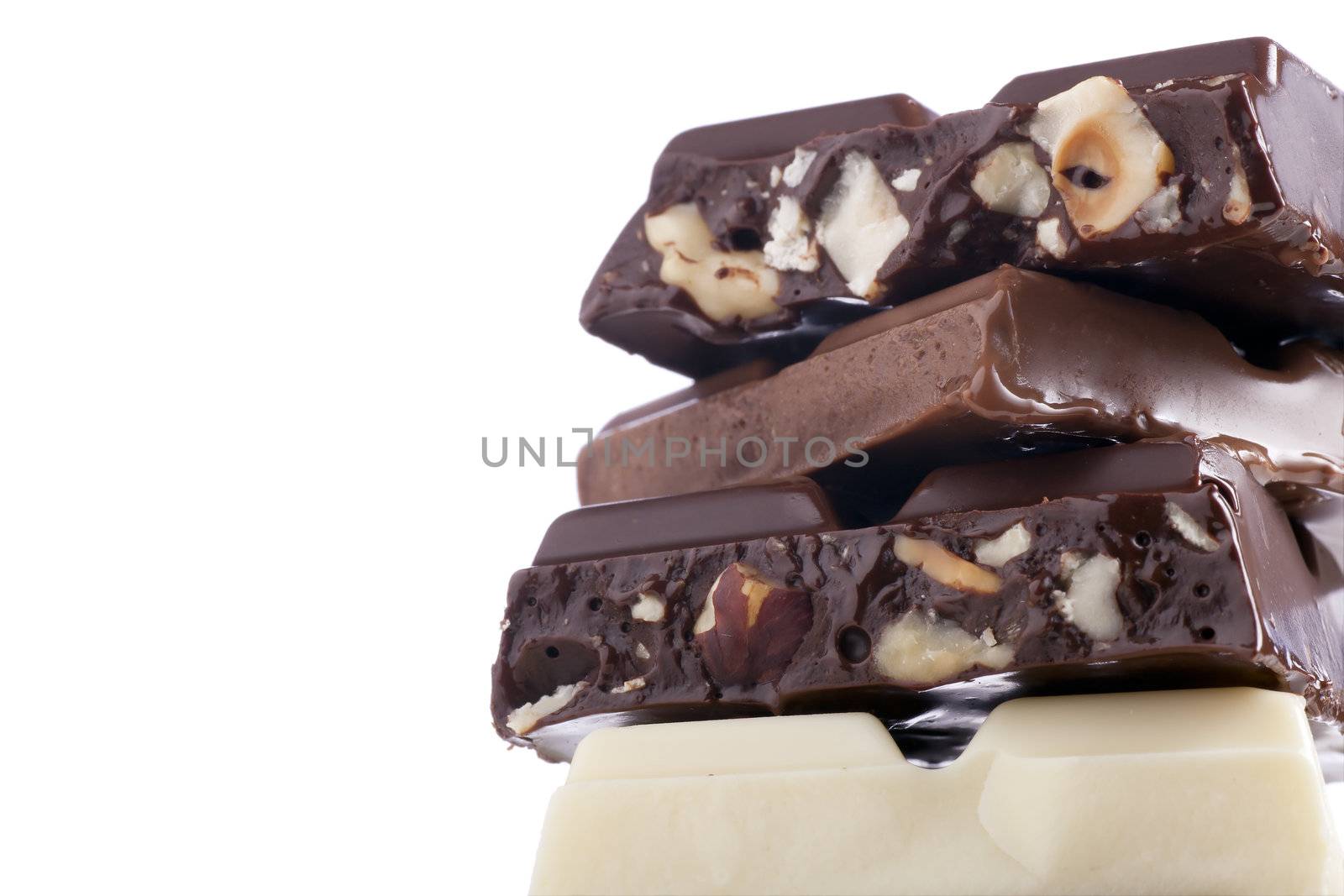 Milk chocolate, white chocolate and dark chocolate with nuts