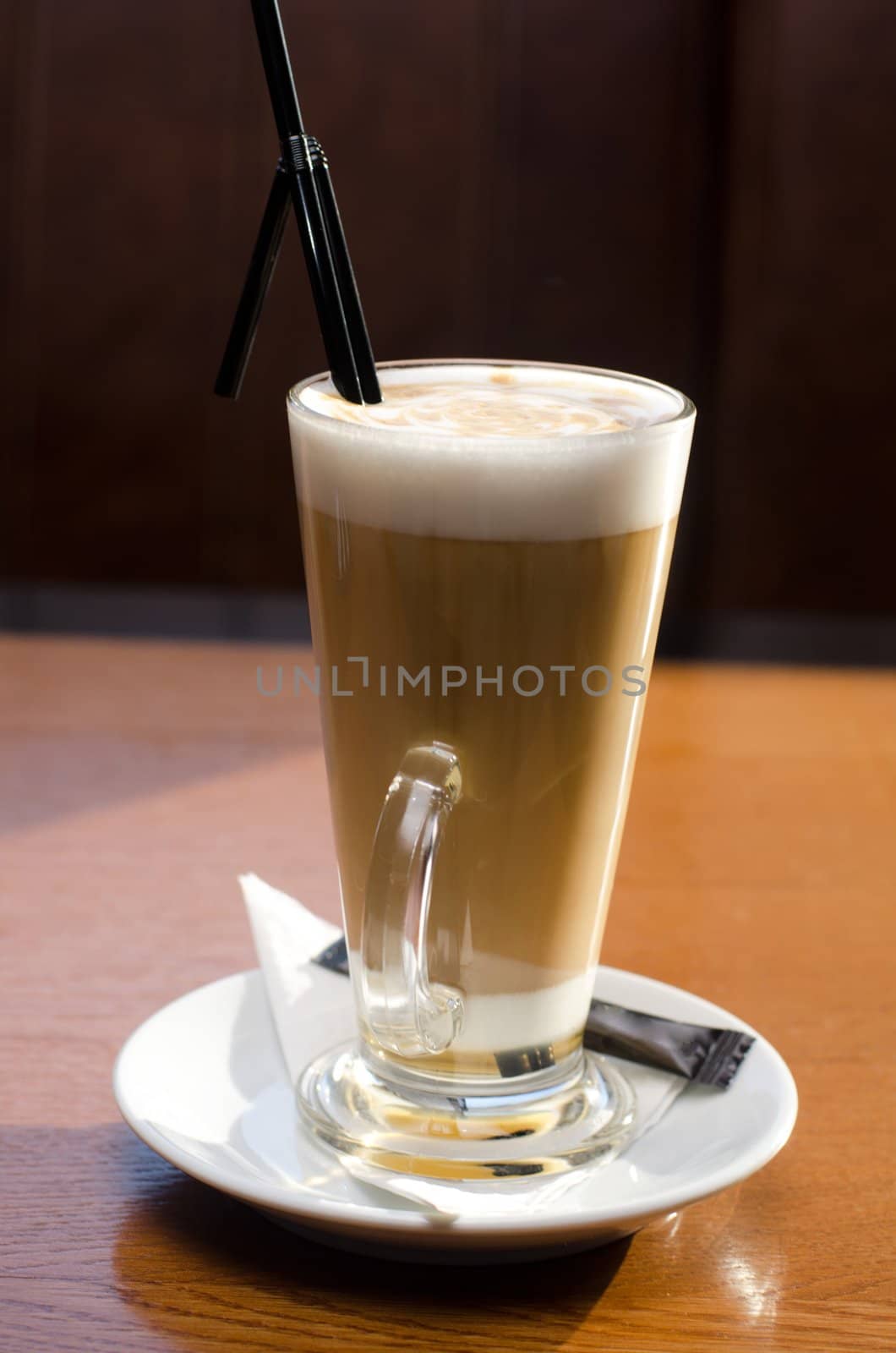 Latte coffee cup closeup at the table