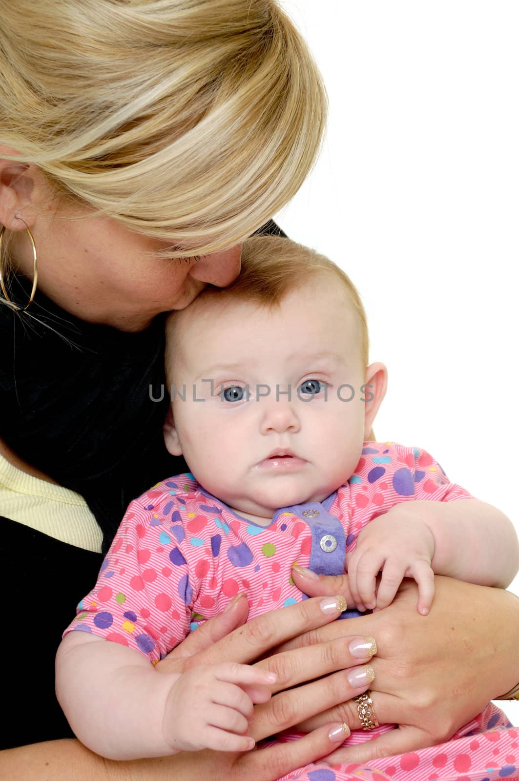 Mother is kissing baby by cfoto