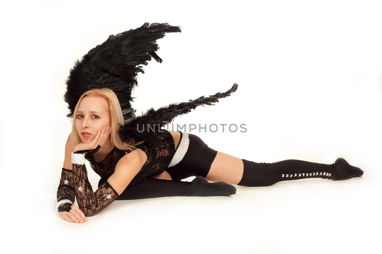 Model in costume of black angel posing for photo