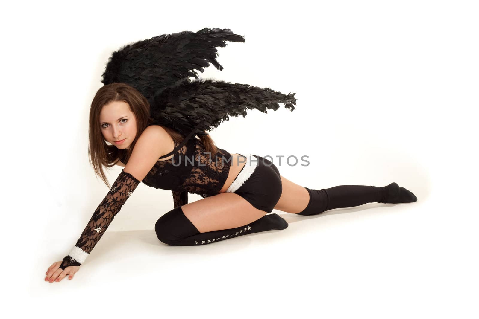 Model in costume of black angel posing for photo