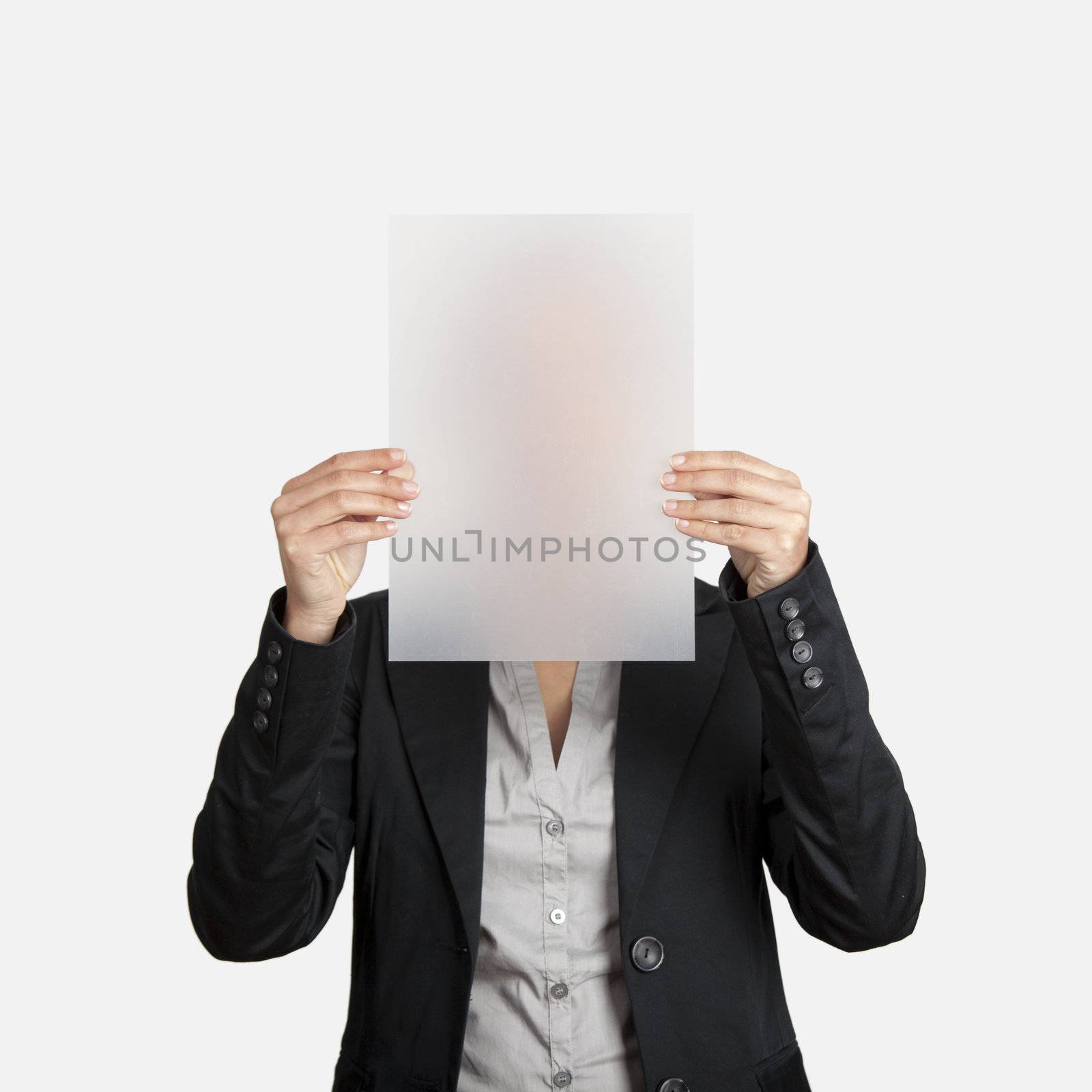 Woman showing a blank translucid paper sheet in front of her head
