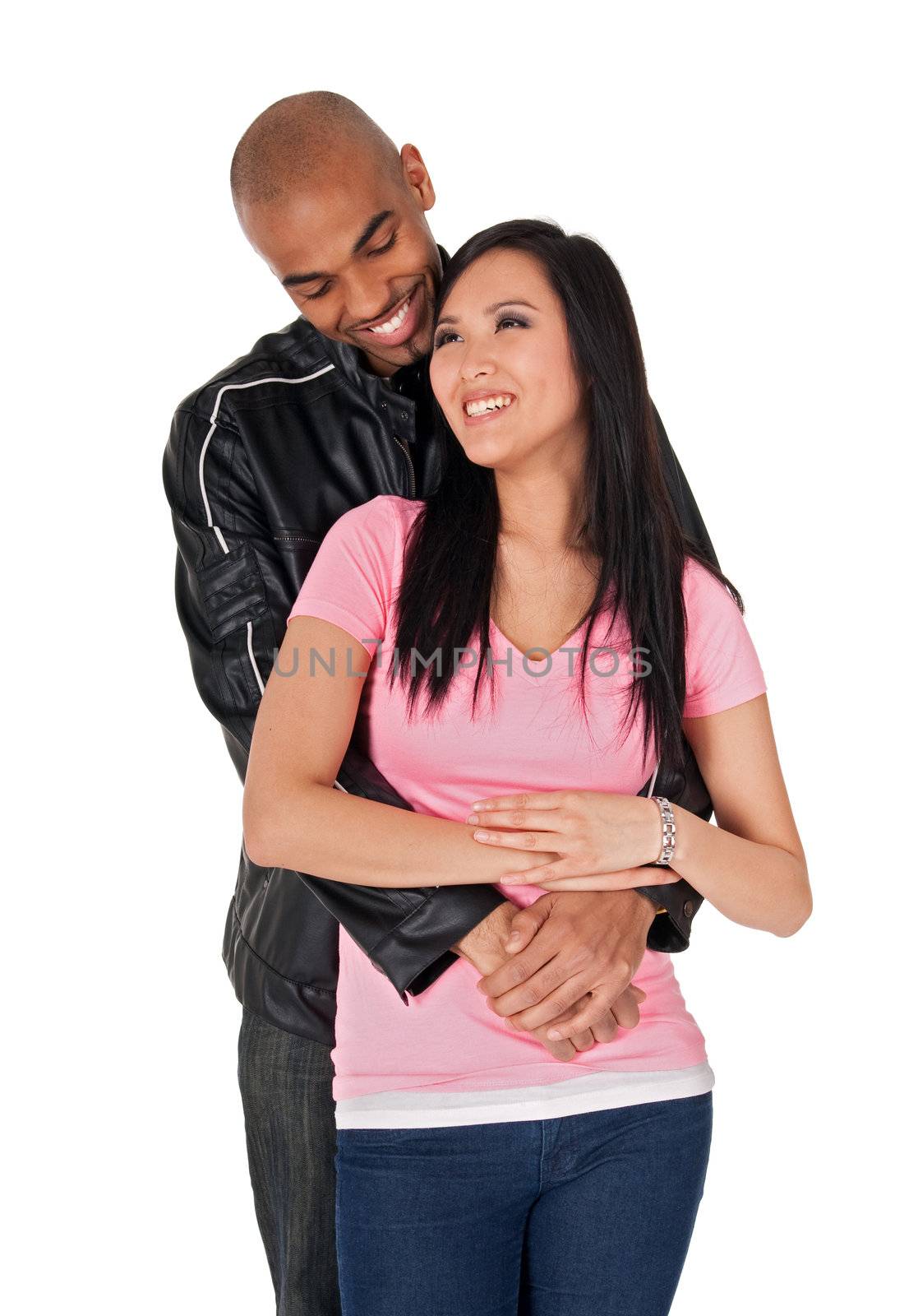 Young couple embracing and smiling - Asian girl with African American boyfriend.