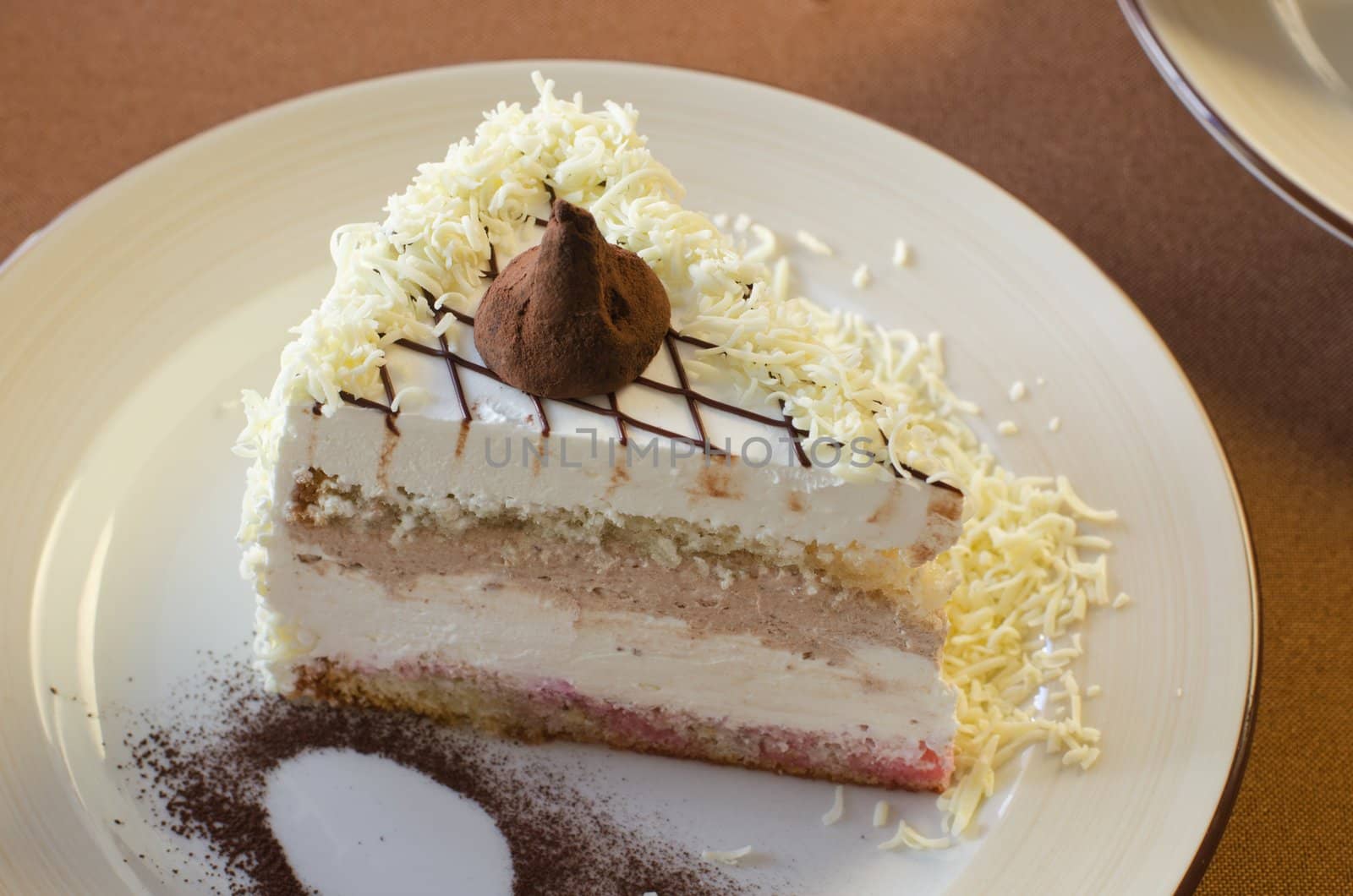 tasty cake at white plate closeup photo