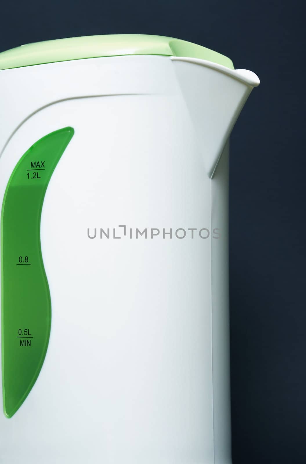 Extreme closeup of modern electric kettle on dark background