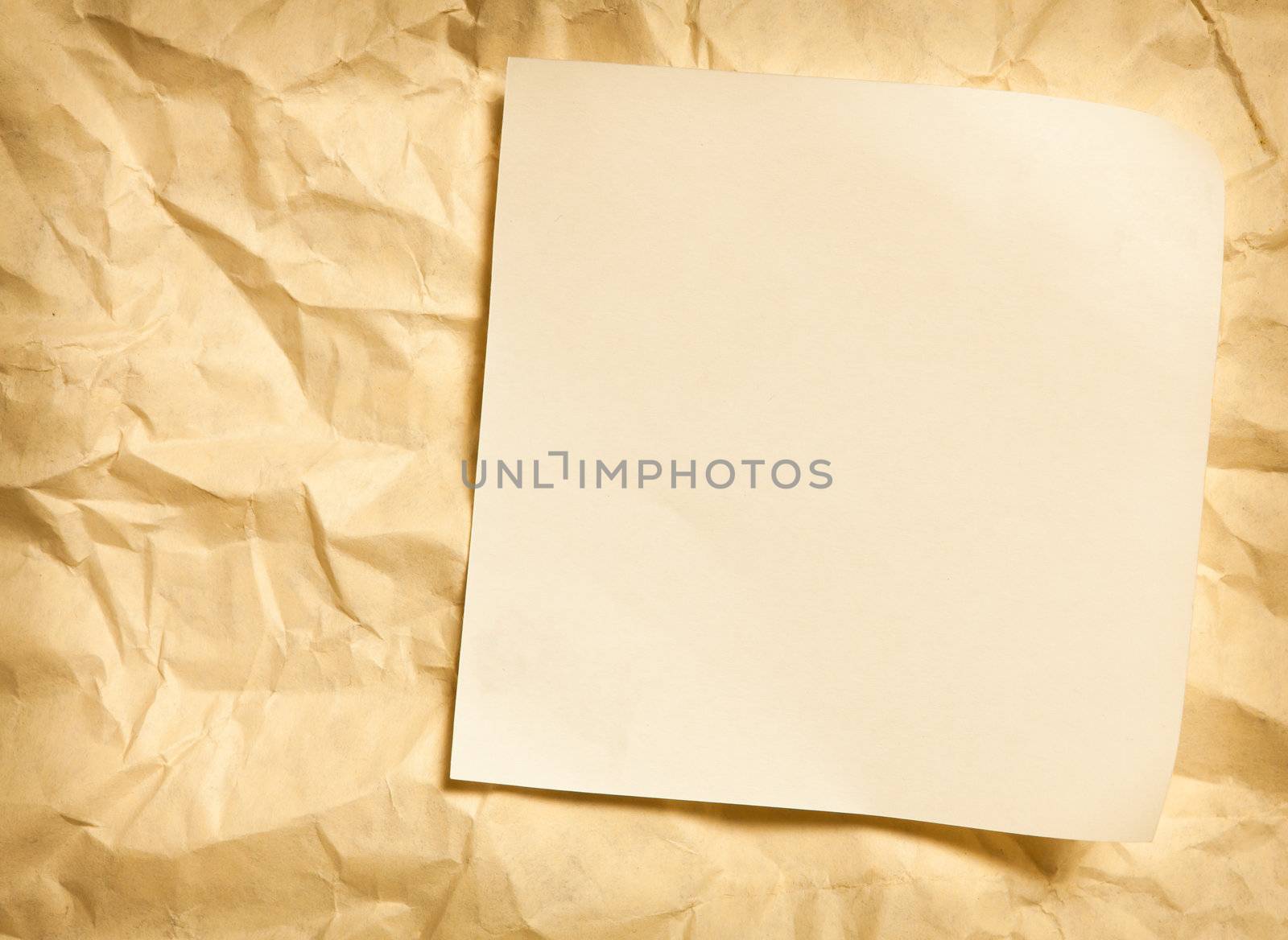 paper note on wrinkled paper background by Suriyaphoto