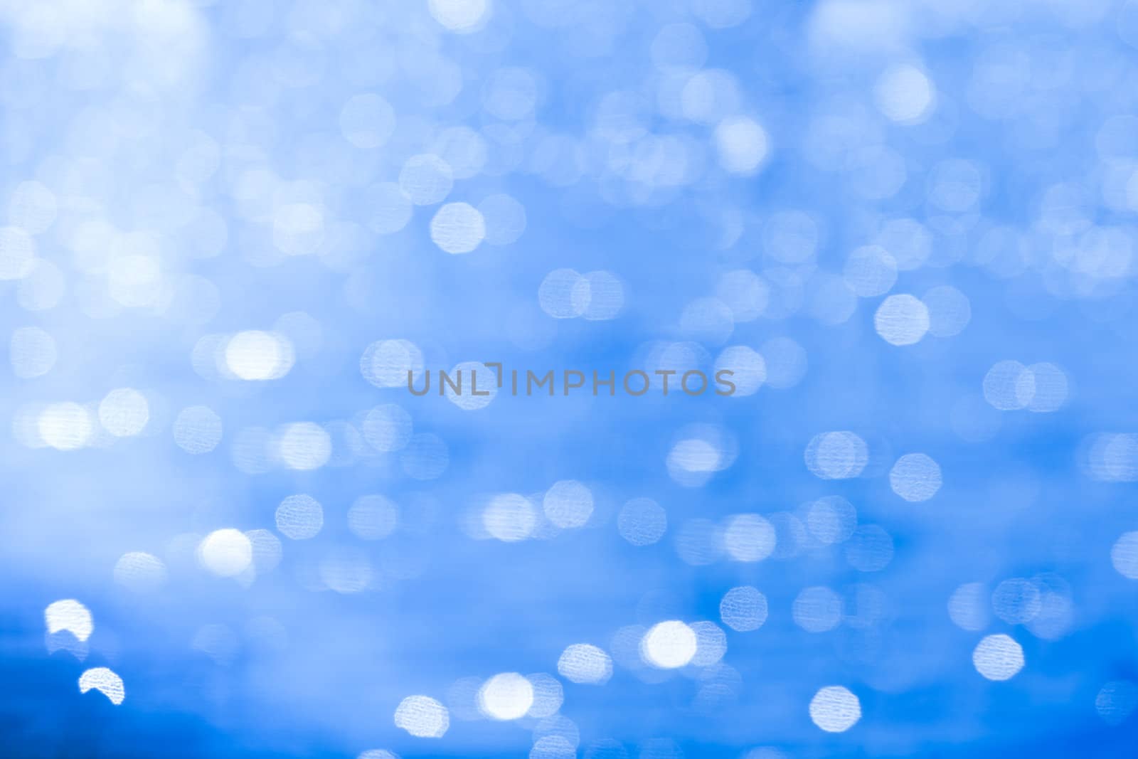 Blue bokeh abstract background  by Suriyaphoto