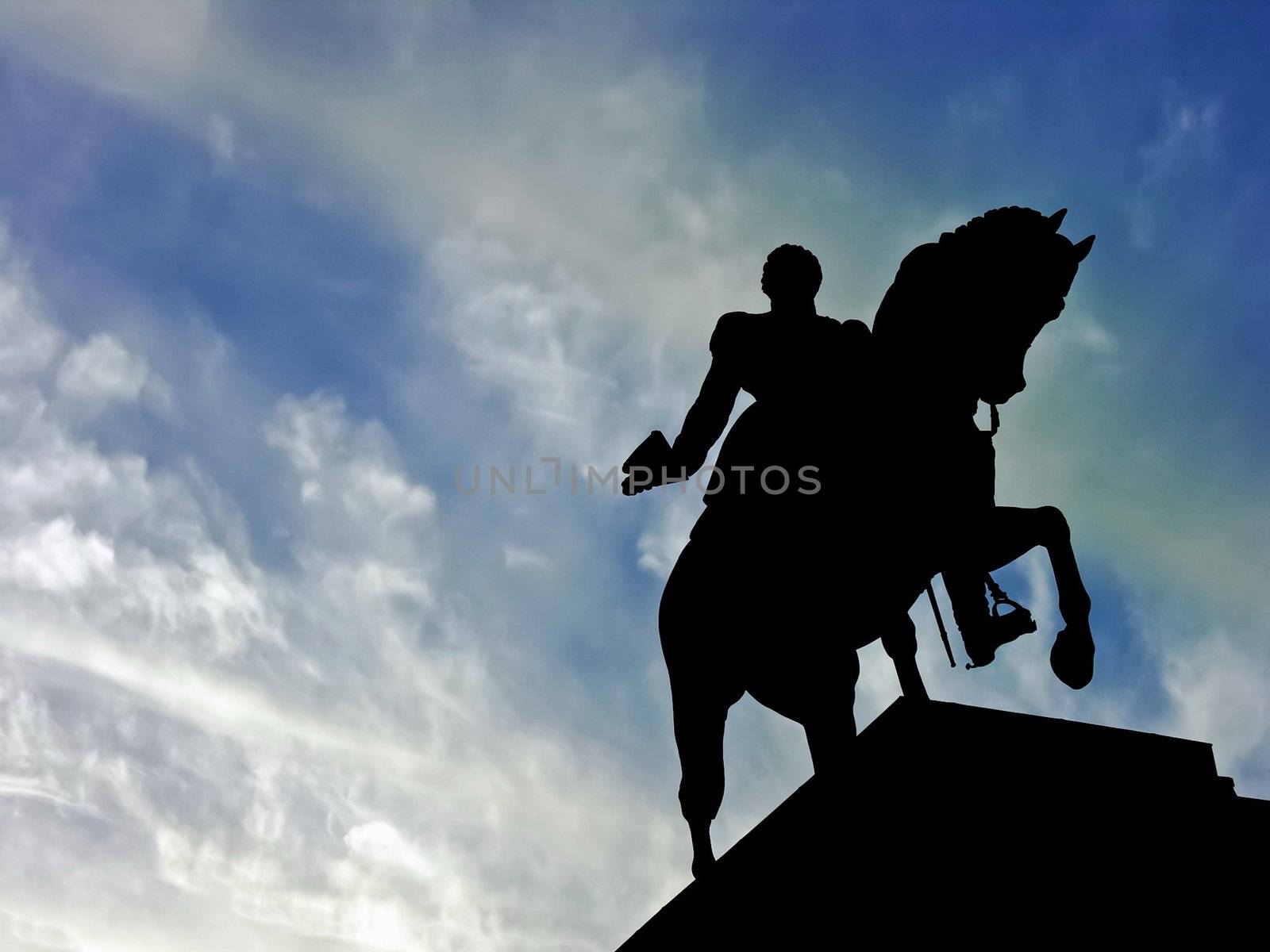 Horse statue silhouette memorial over a blue sky background