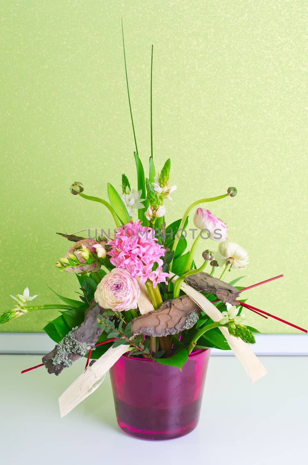 bunch of flowers composition at pot on a table