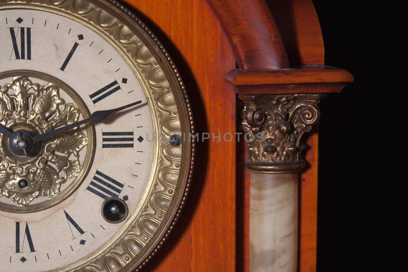 antique clock close up on black background