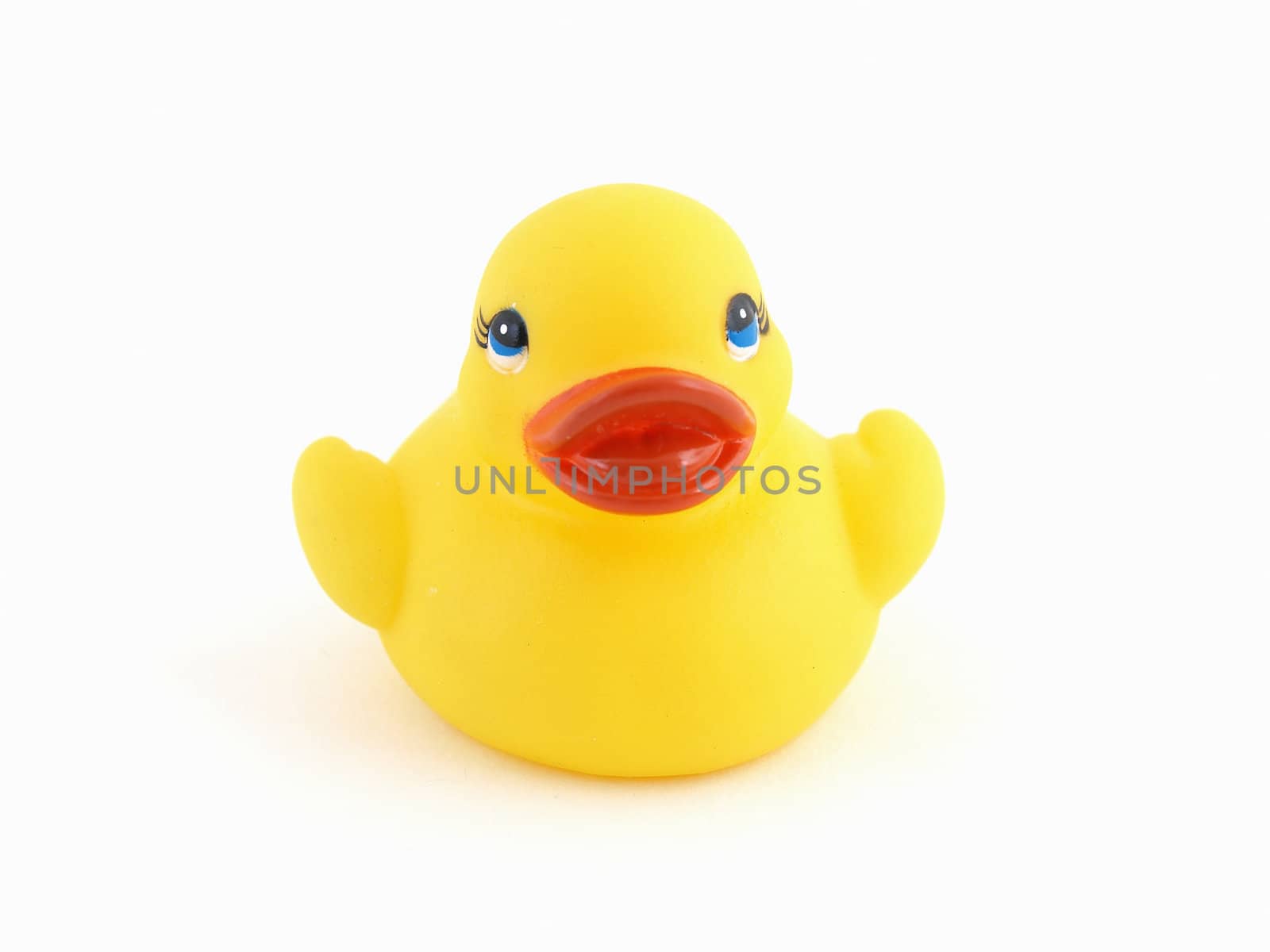 A small yellow rubber duck isolated against a white background.