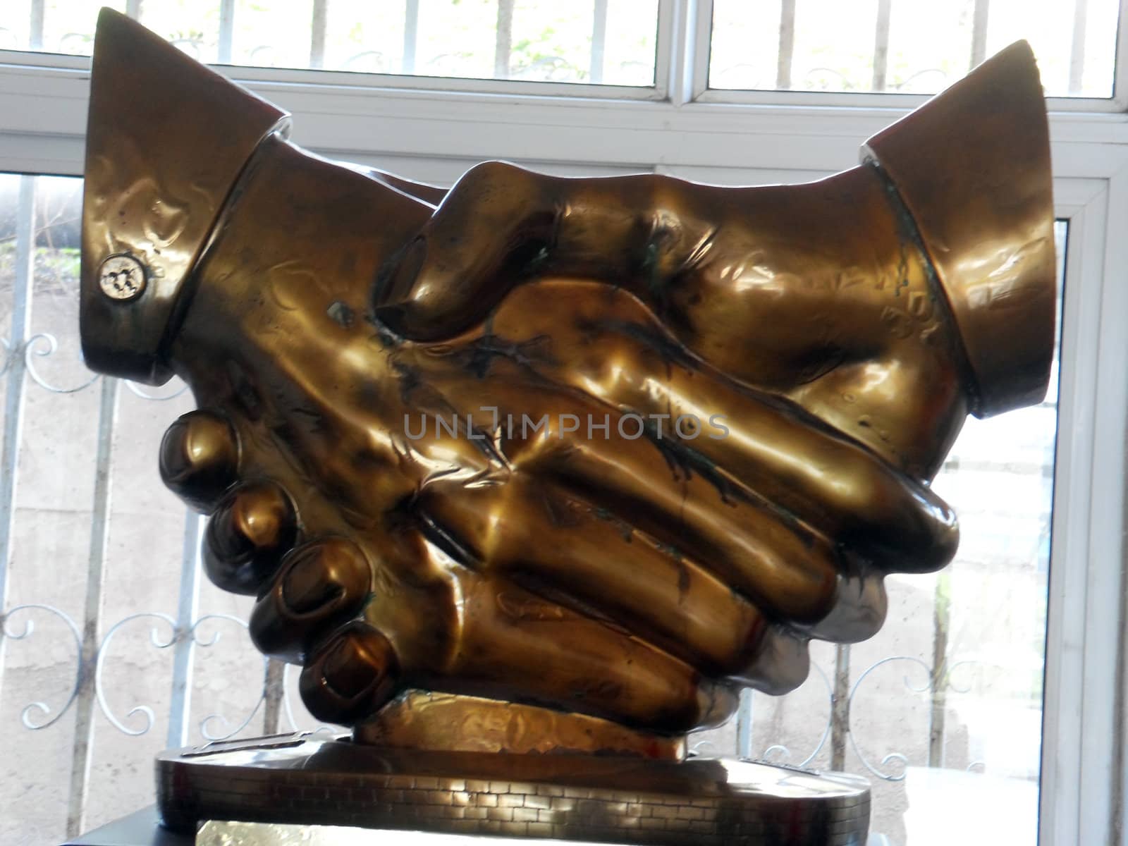 Handshake of bronze sculpture