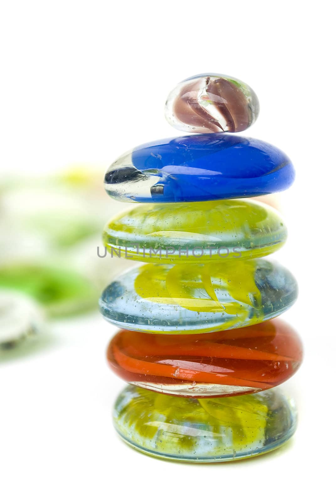 balanced colorful stones isolated on white background