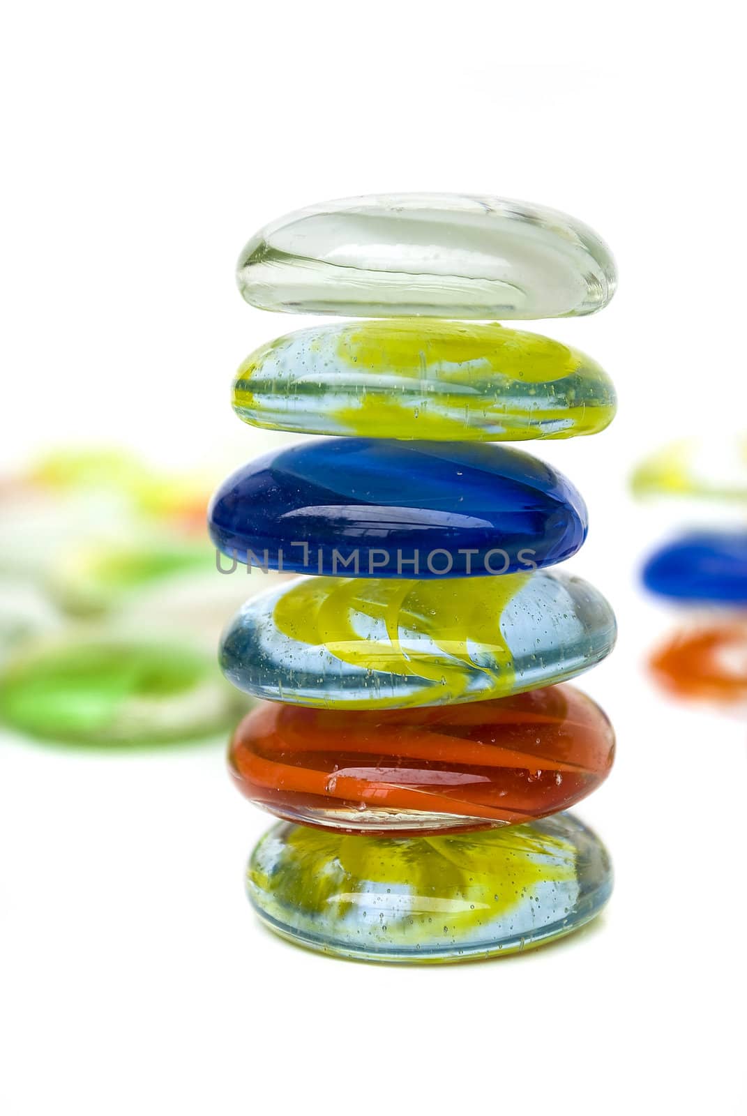 balanced colorful stones isolated on white background