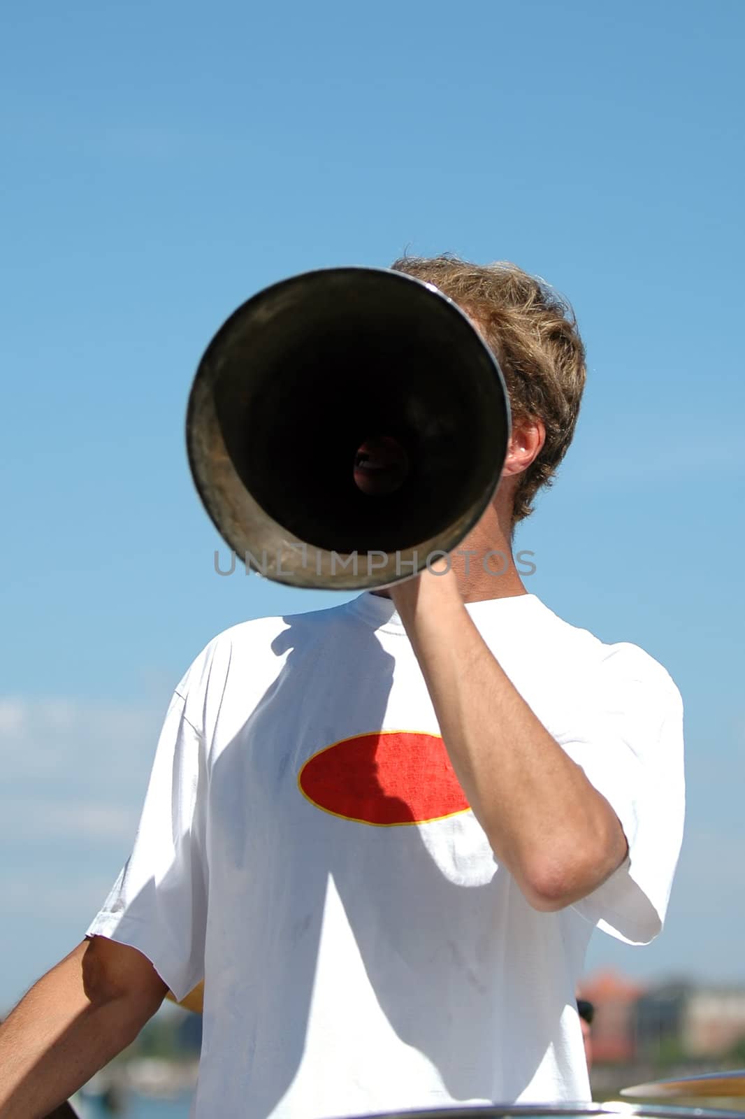 Man is speaking in a megaphone
