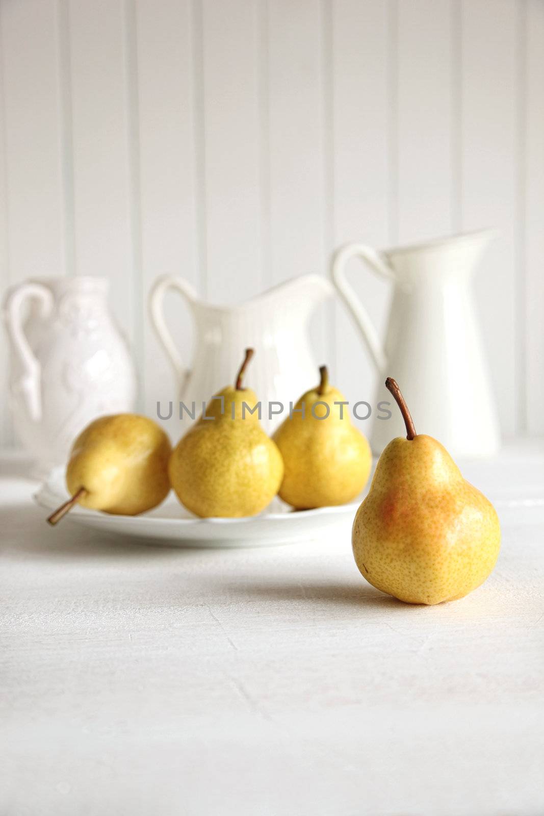 Fresh pears on old table by Sandralise