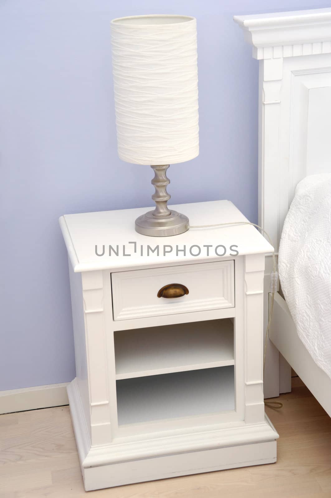 Bedside table with lamp by cfoto
