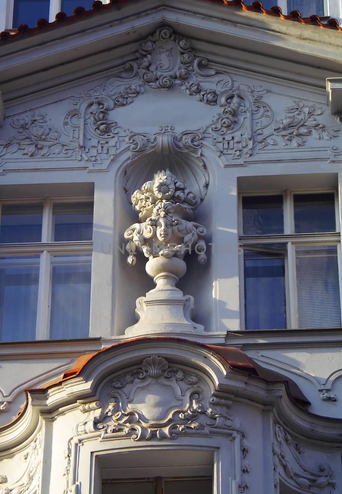 historic building, stucco on the walls, a statue