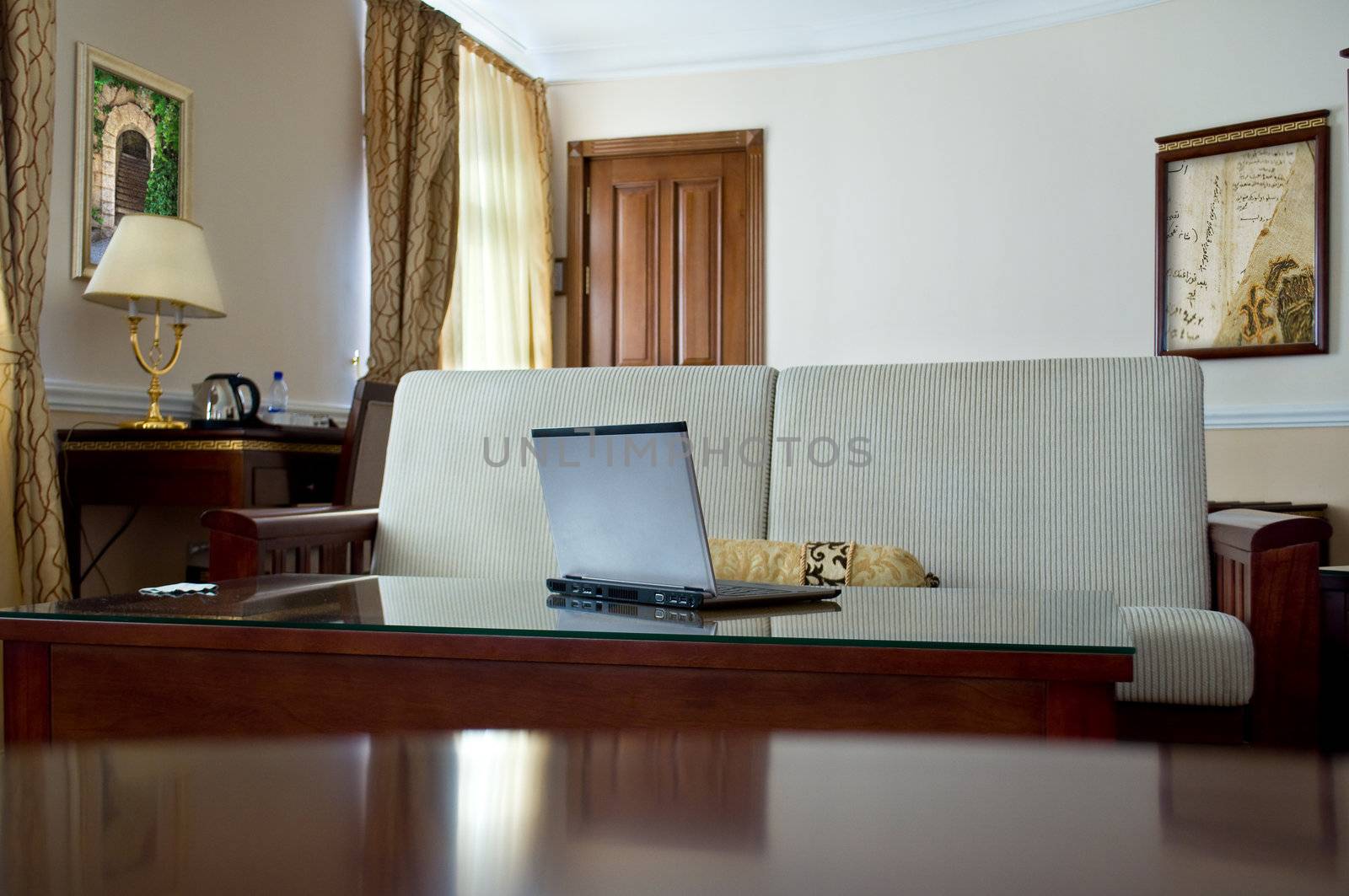 notebook (laptop) on a  home interior by Sergieiev