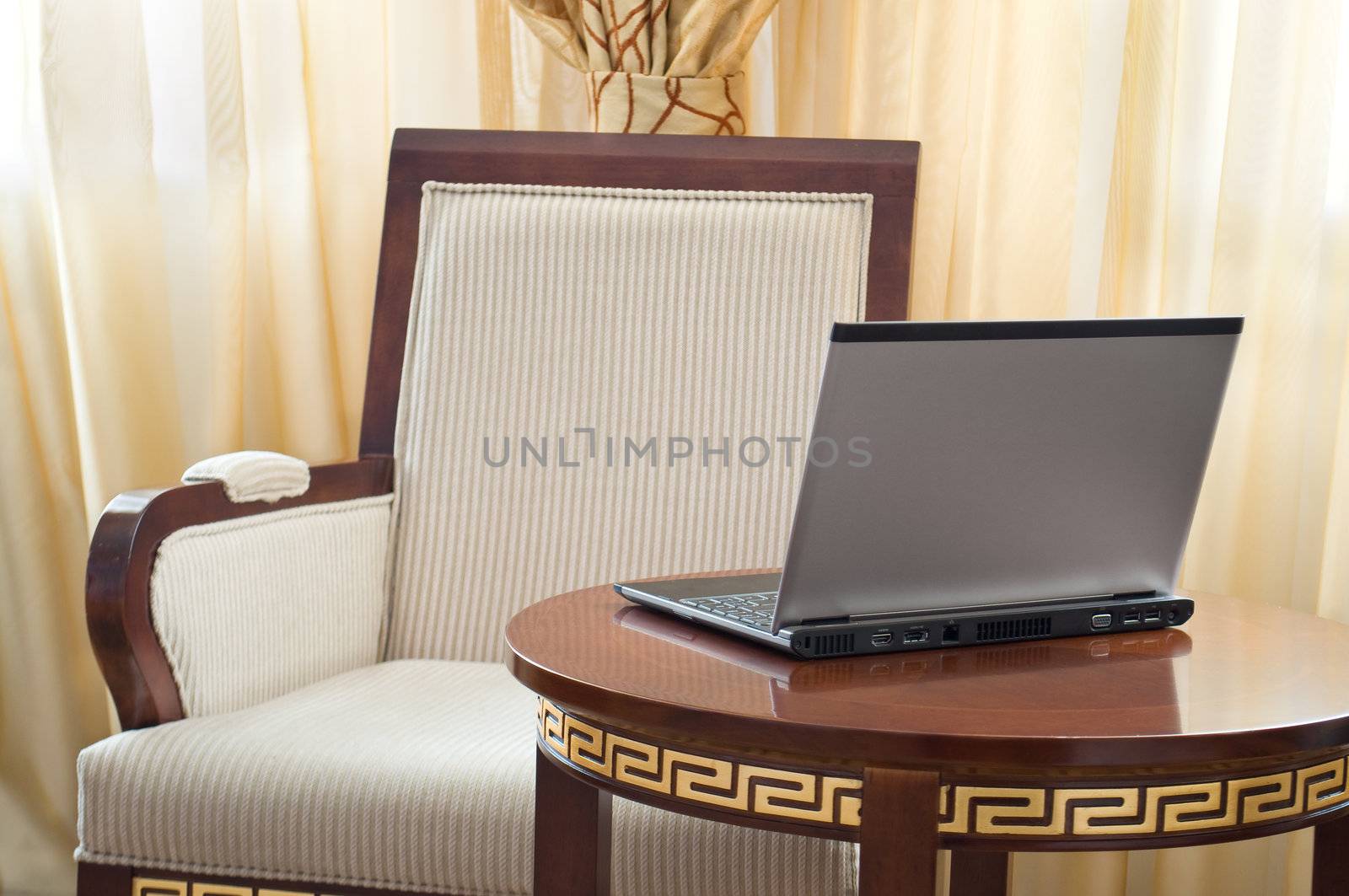 notebook (laptop) on a background of home interior