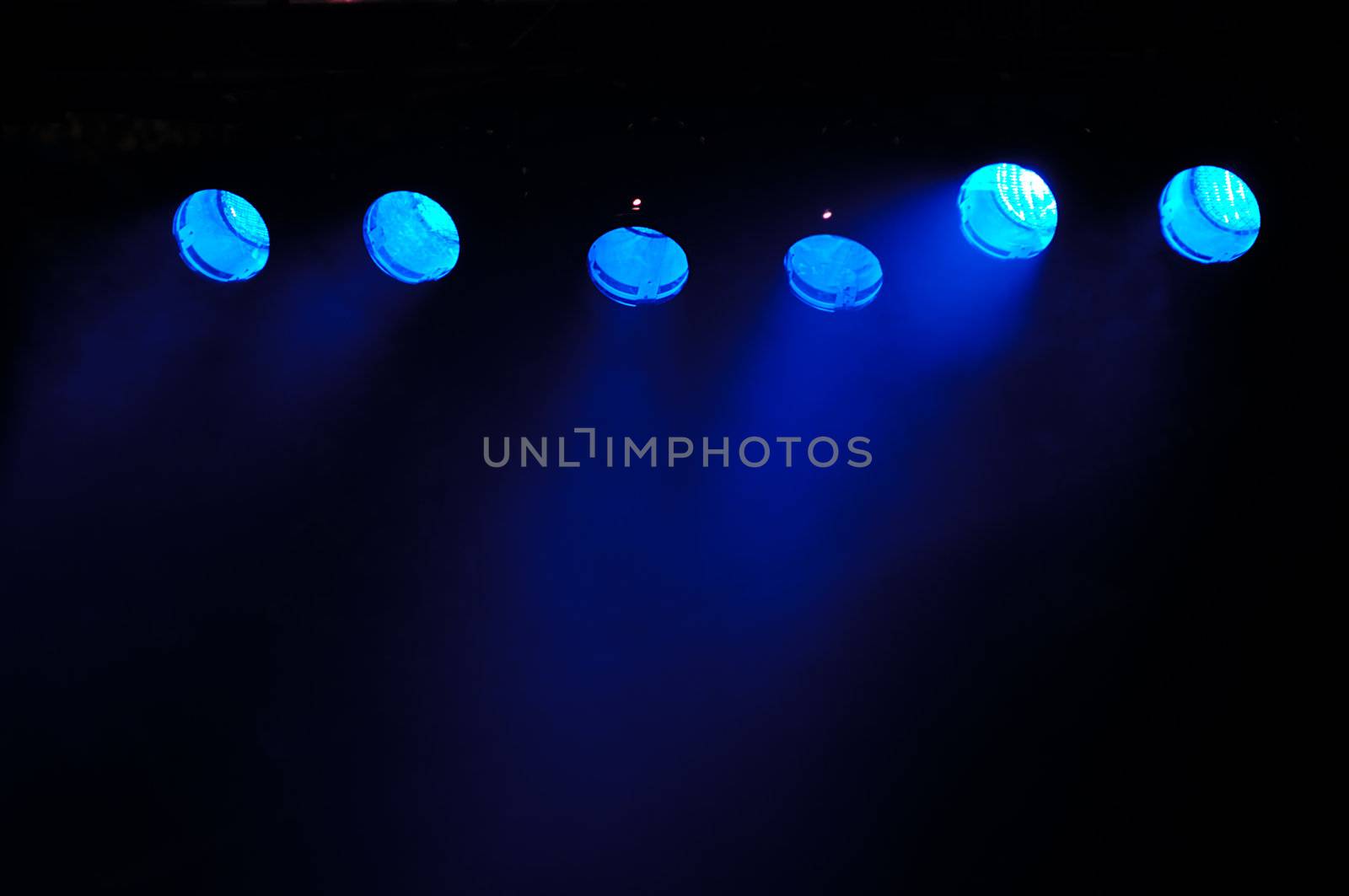 Blue spotlights and smoke by cfoto