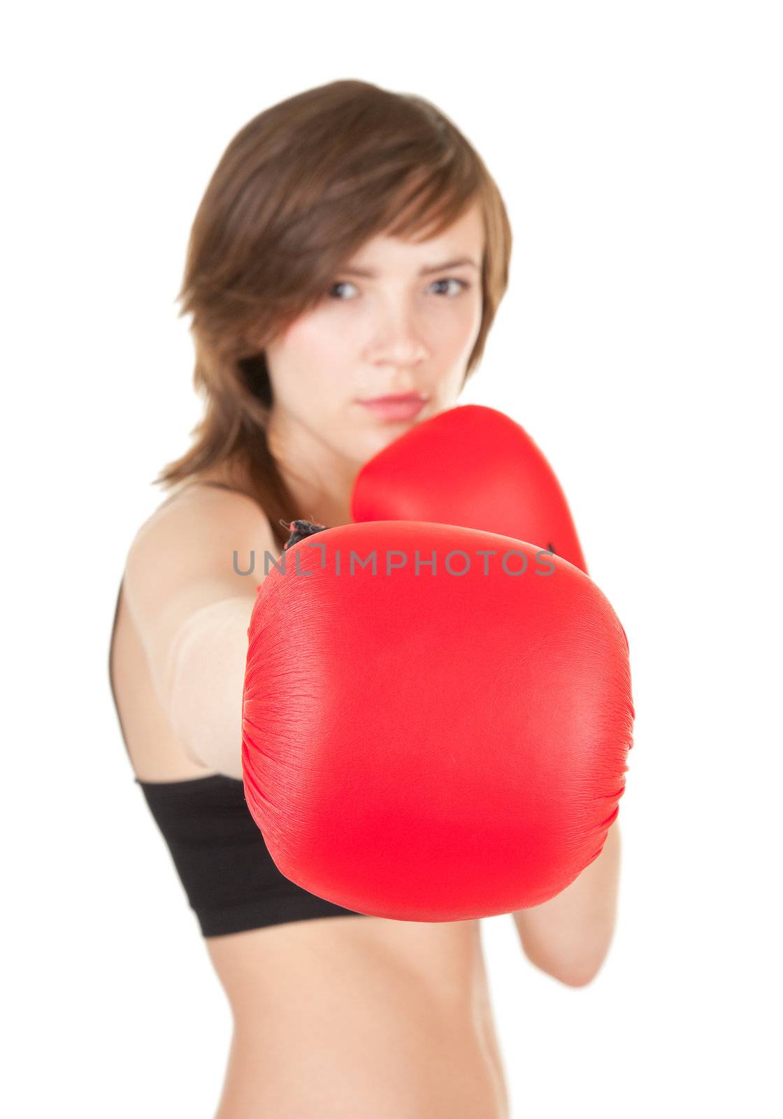 portrait of sports girl with boxing gloves. Focus on the right glove.