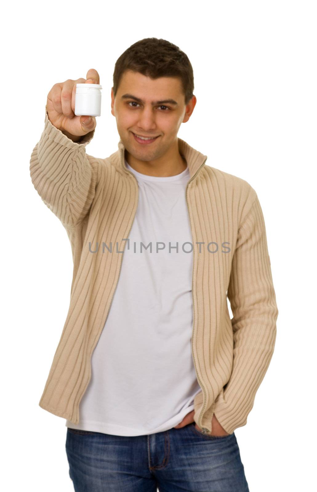 young man holding a bottle of medicine. Focus on arm.
