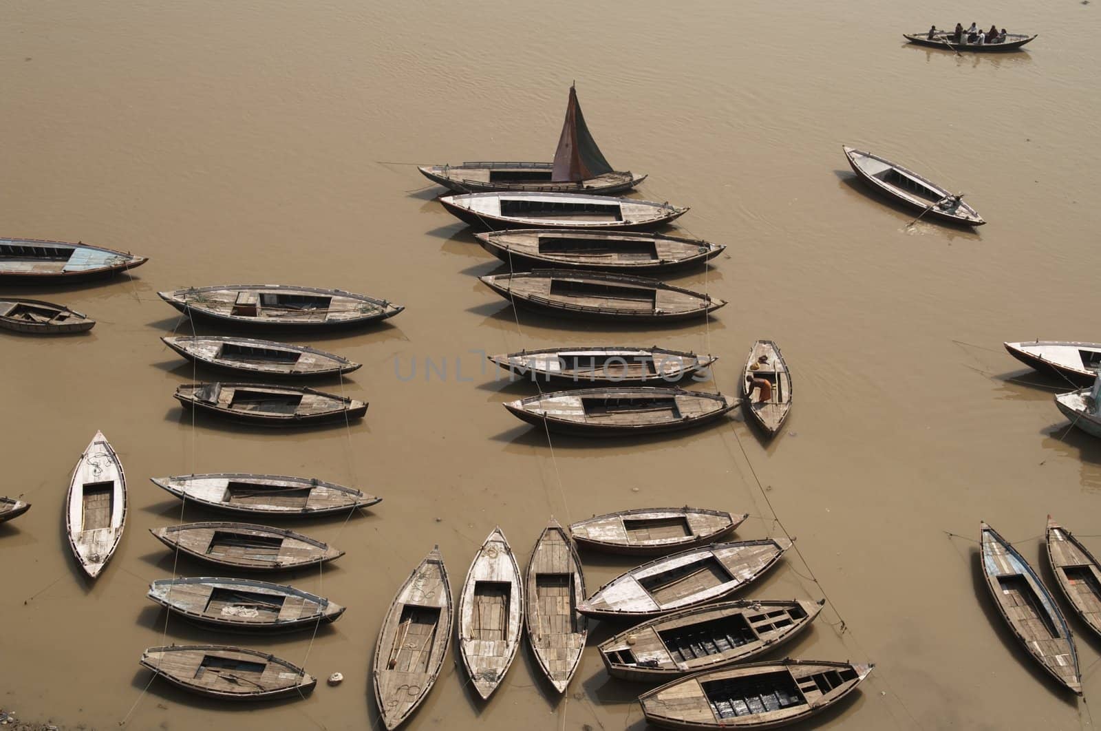 Rowing boats moored on the Ganges River at Varanasi, India
