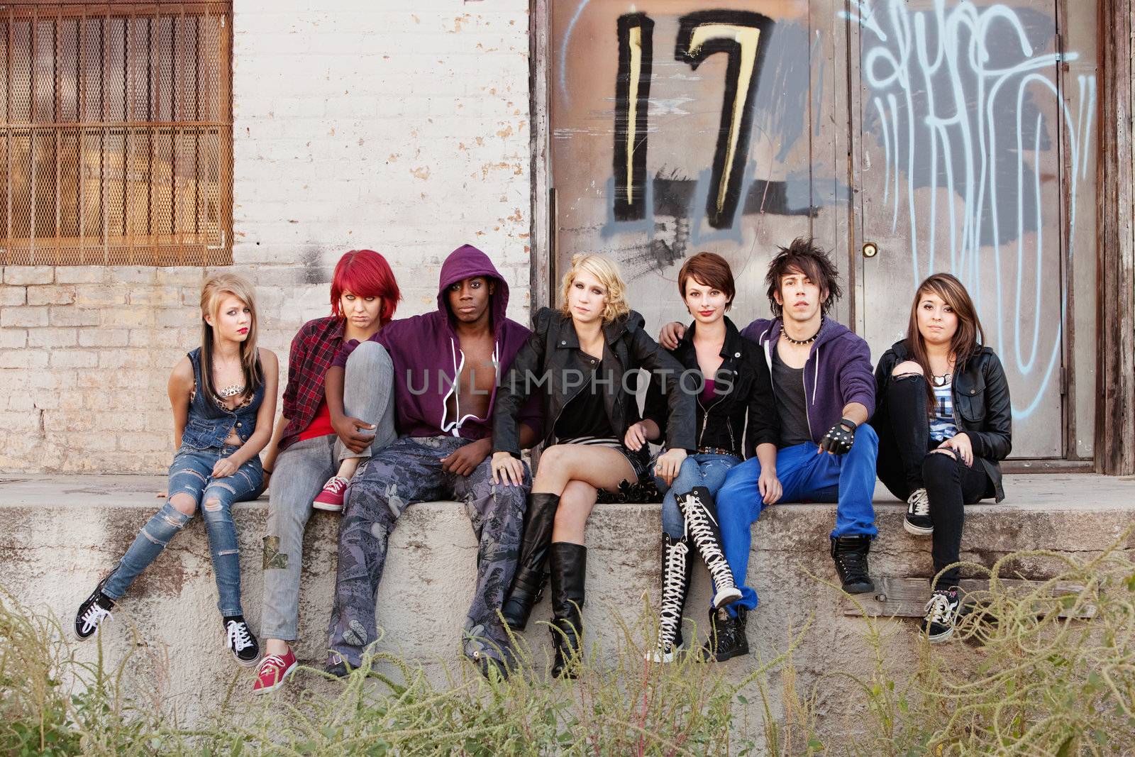 Serious looking group of young punk teens by Creatista