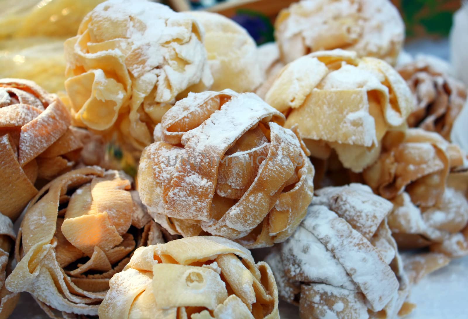 Ball shaped cookies made from domestic pasta with powder sugar