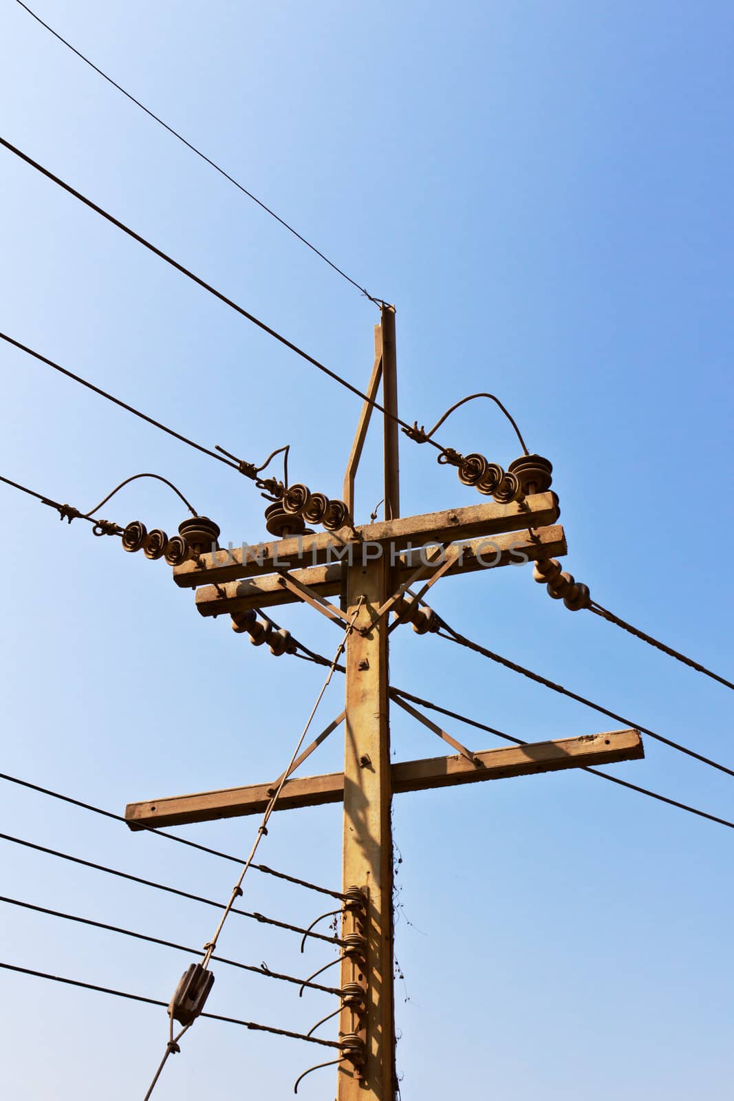 A pole with power lines transporting electricity.