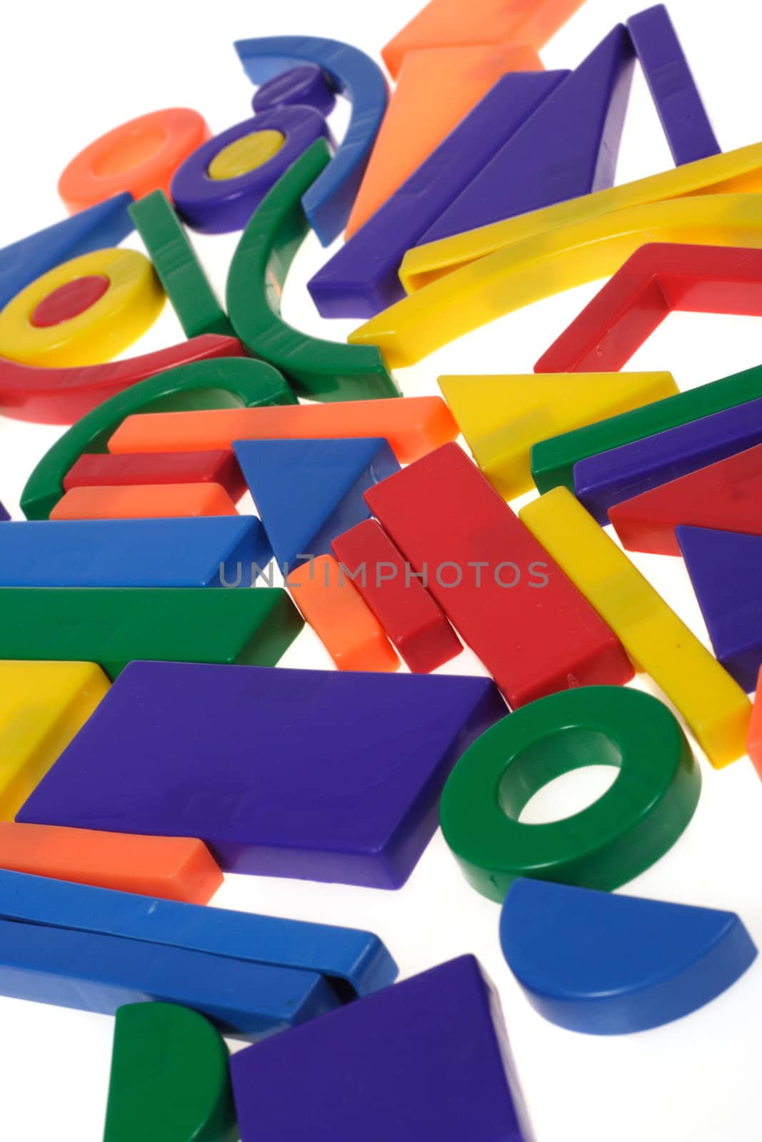 Plastic blocks geometrical figures photo on white background