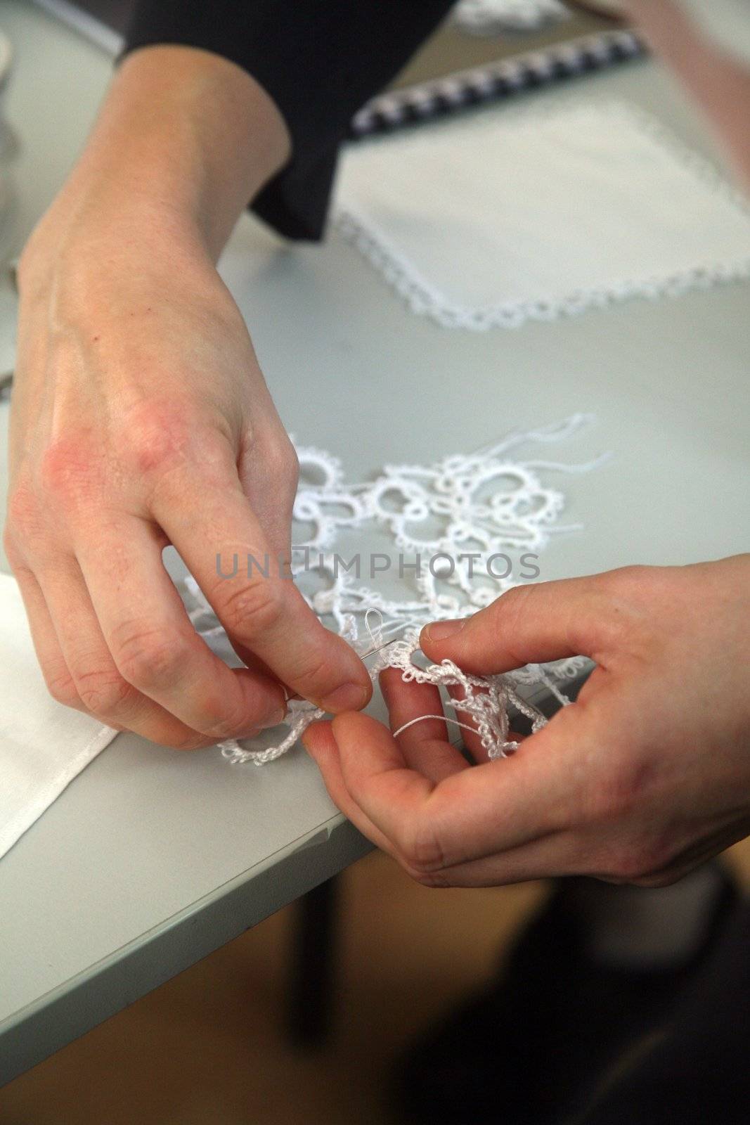 Process of lace-making by atlas