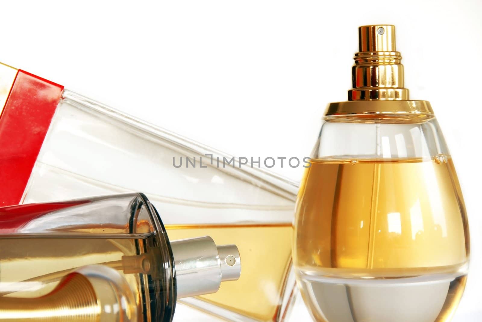 group of several perfumes in glass bottles over white background