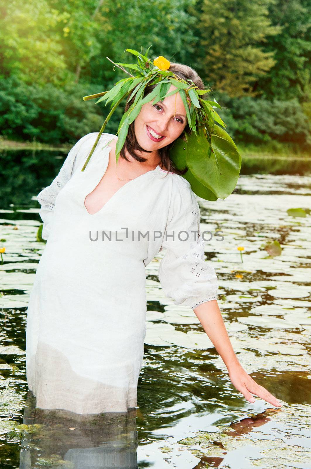 Portrait of young pregnant woman in traditional costume