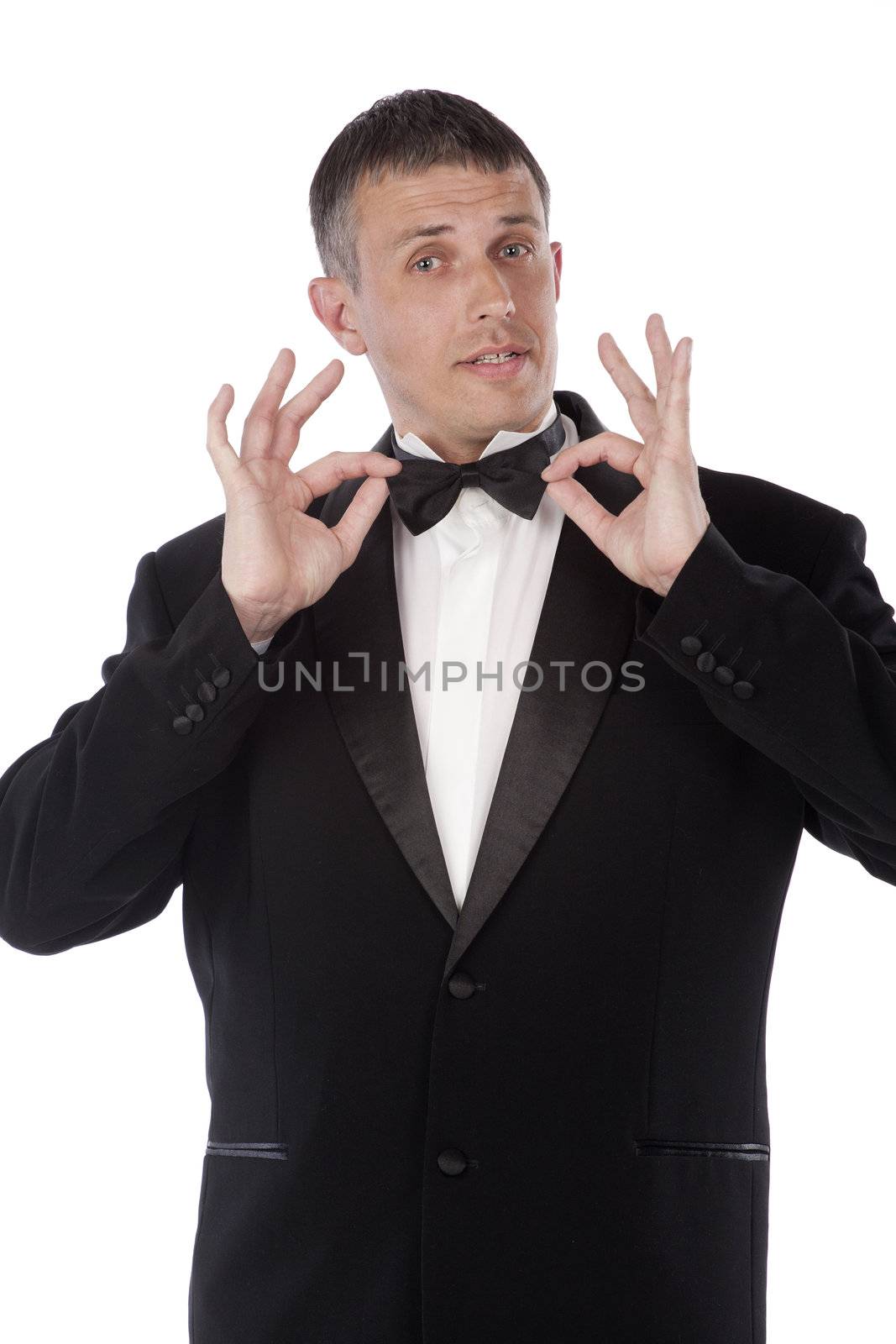 The charming imposing man tries on a new classical tuxedo for solemn ceremony