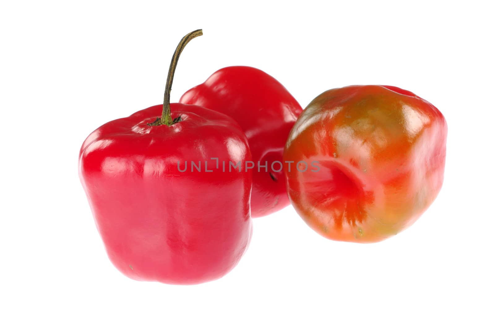 Rocoto (lat. Capsicum pubescens), hot chili pepper from South America isolated on white (Selective Focus, Focus on the front)