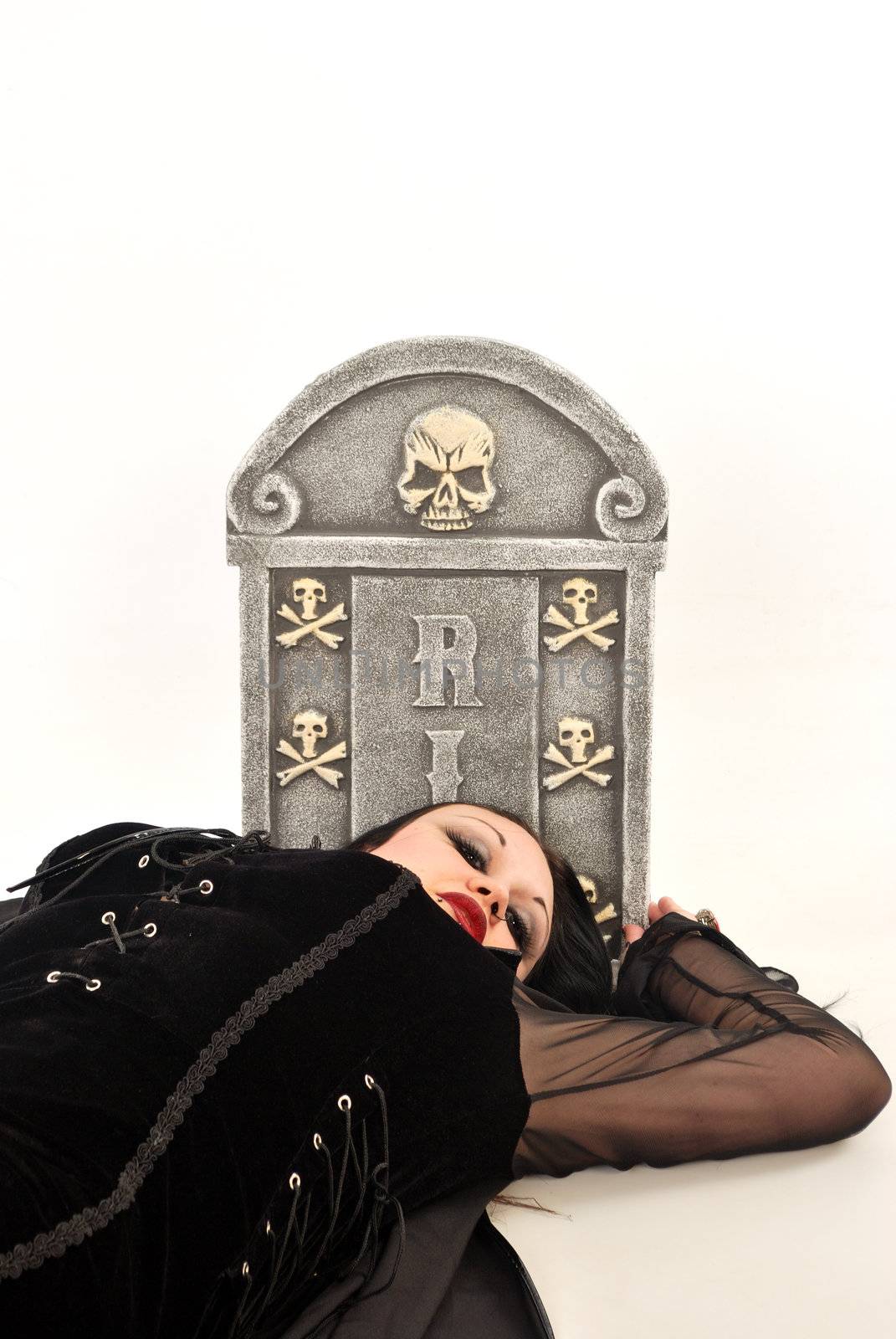 gothic woman lying by grave