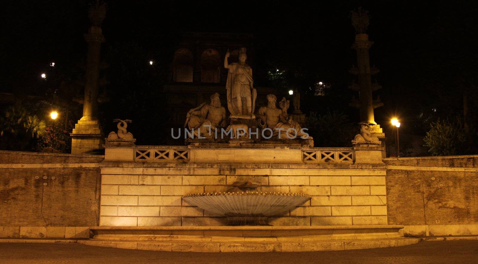 The Rome between the Tiber and the Aniene fountain, located in Piazza del Popolo, Rome, Italy. Shot at night. 