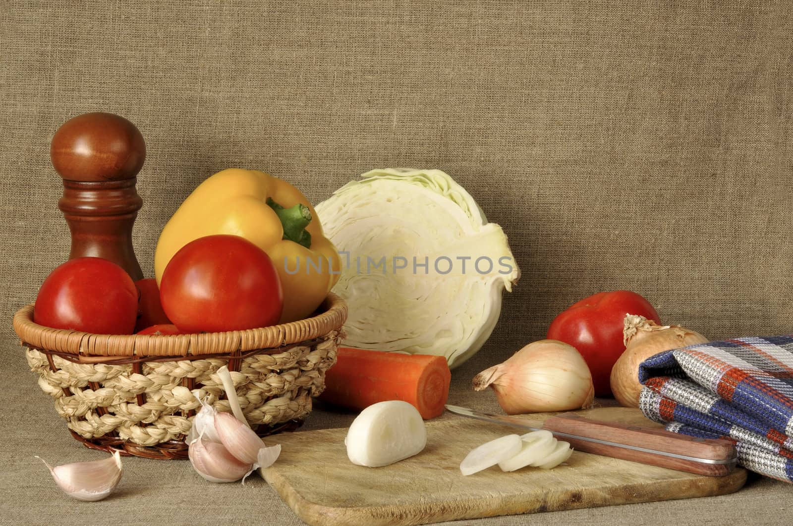 Vegetables different and wattled ware against a canvas
