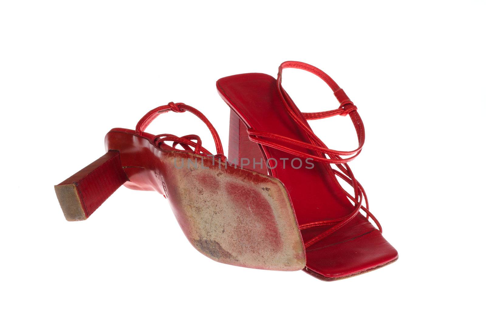 Old red shoes photo on the white background