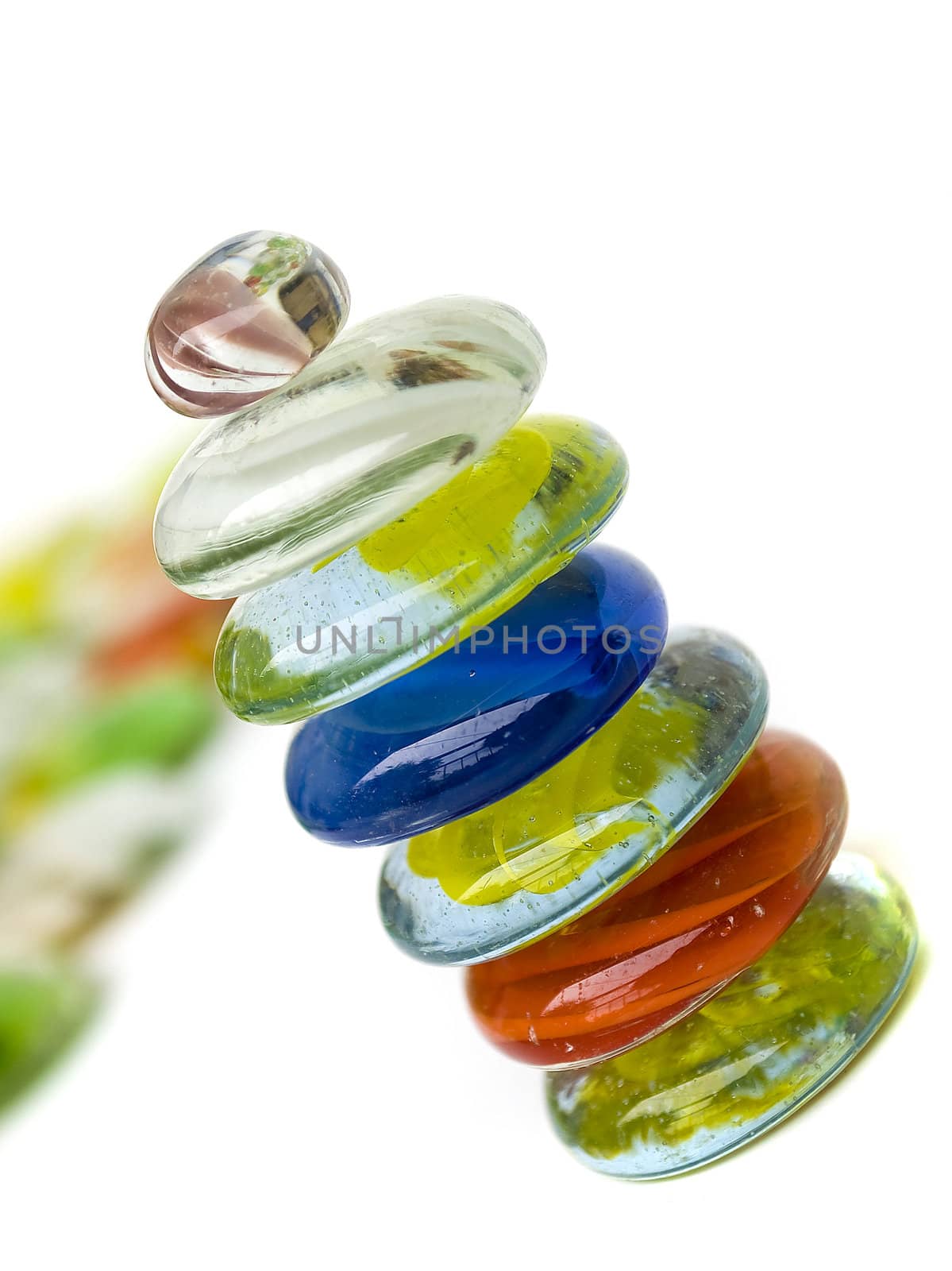 balanced colorful stones isolated on white background