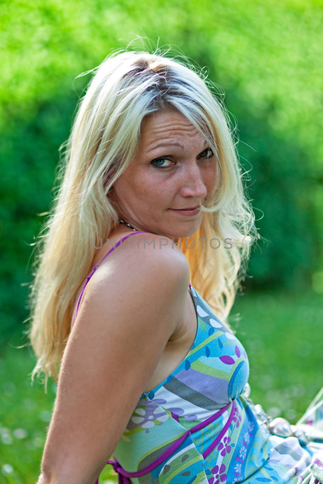 young woman sitting in the garden