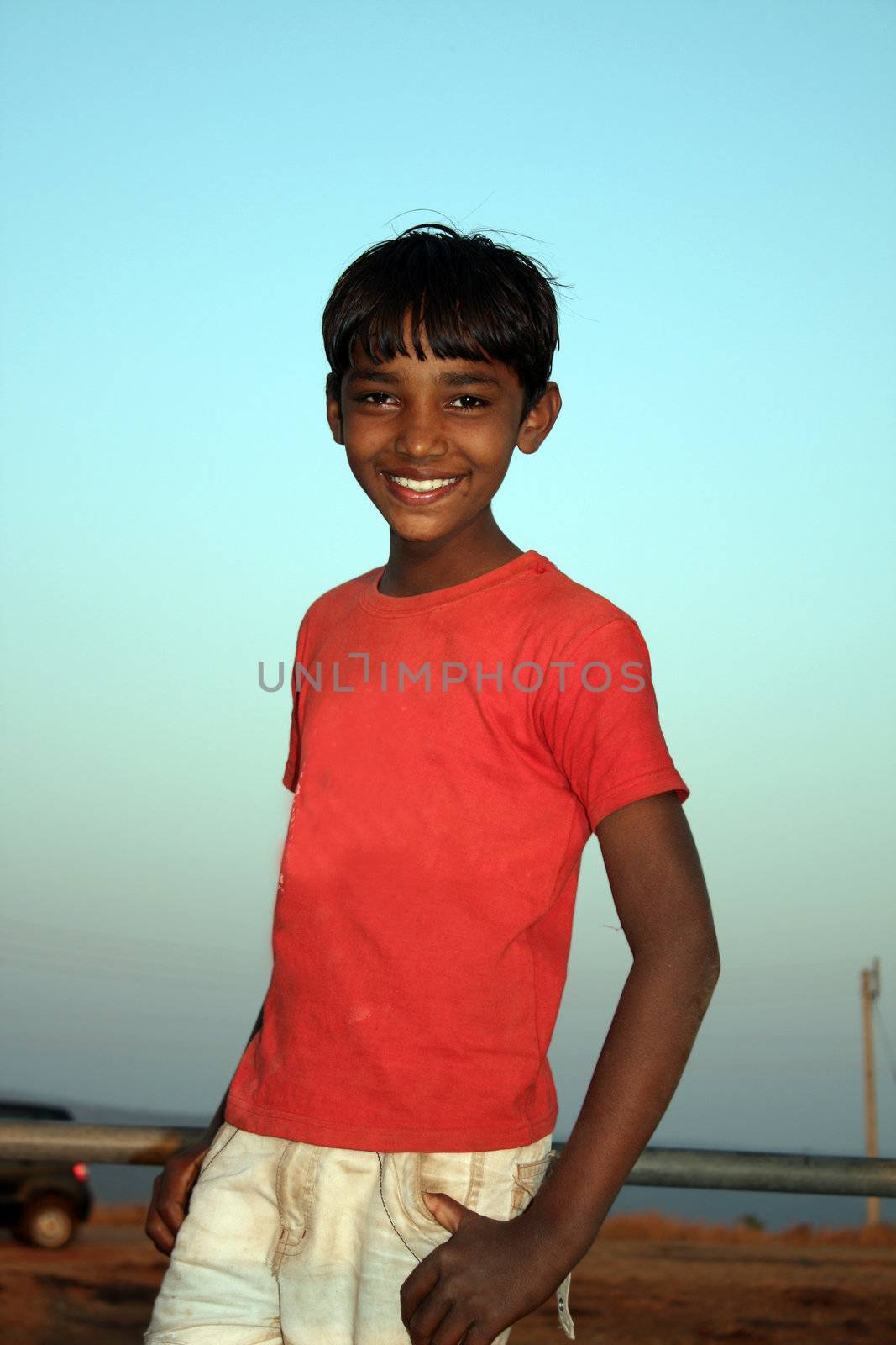 A little Indian teenage boy from rural and poor parts of India.