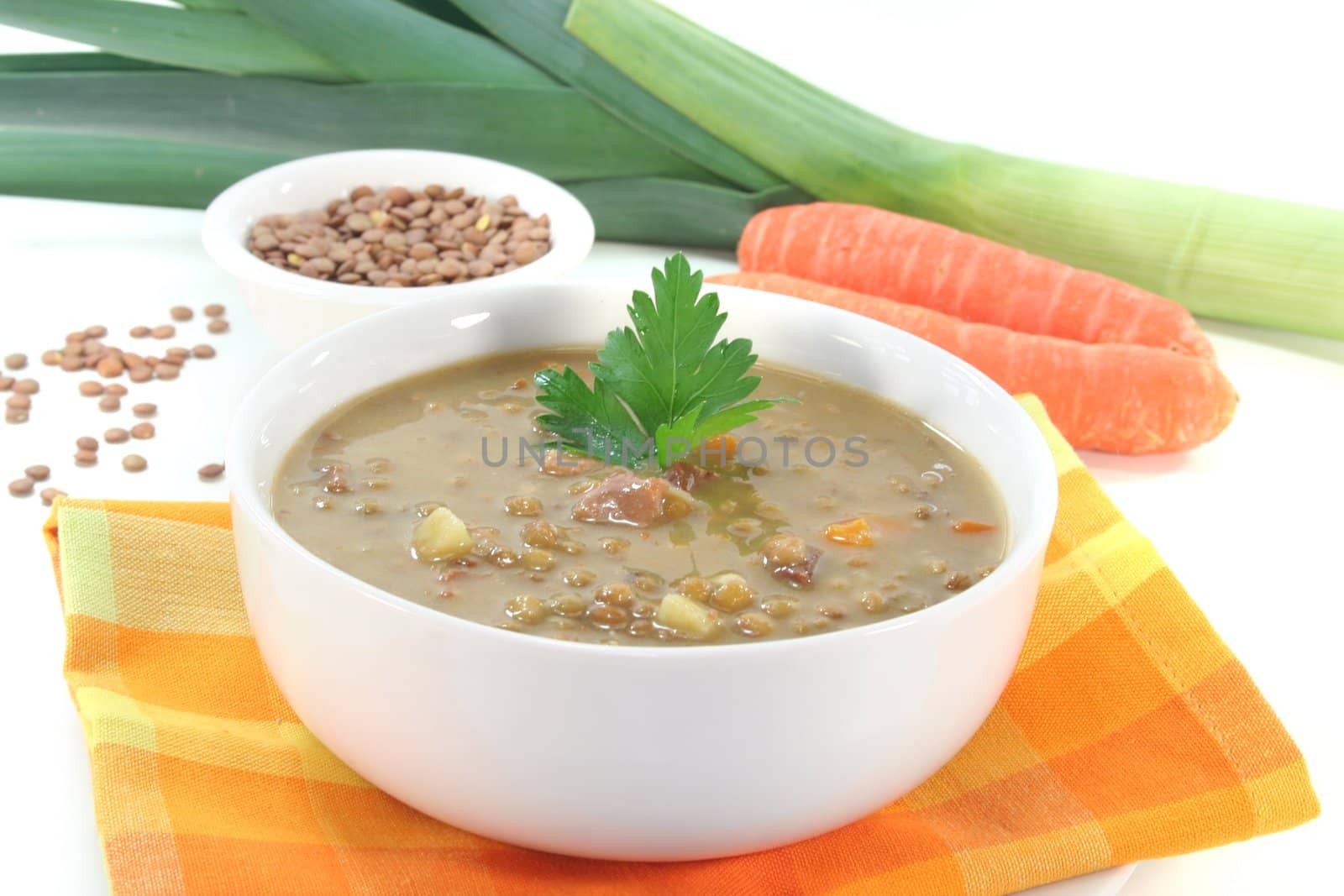Lentil soup with potatoes, bacon and fresh parsley