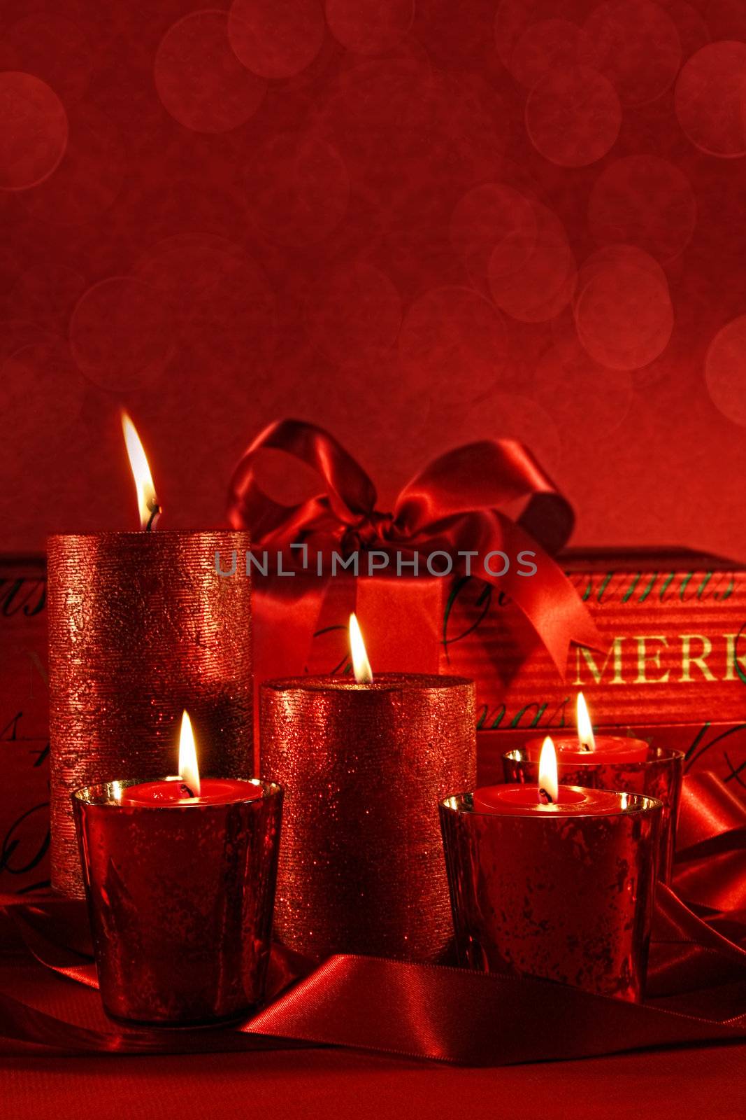 Christmas candles on a red vintage background 