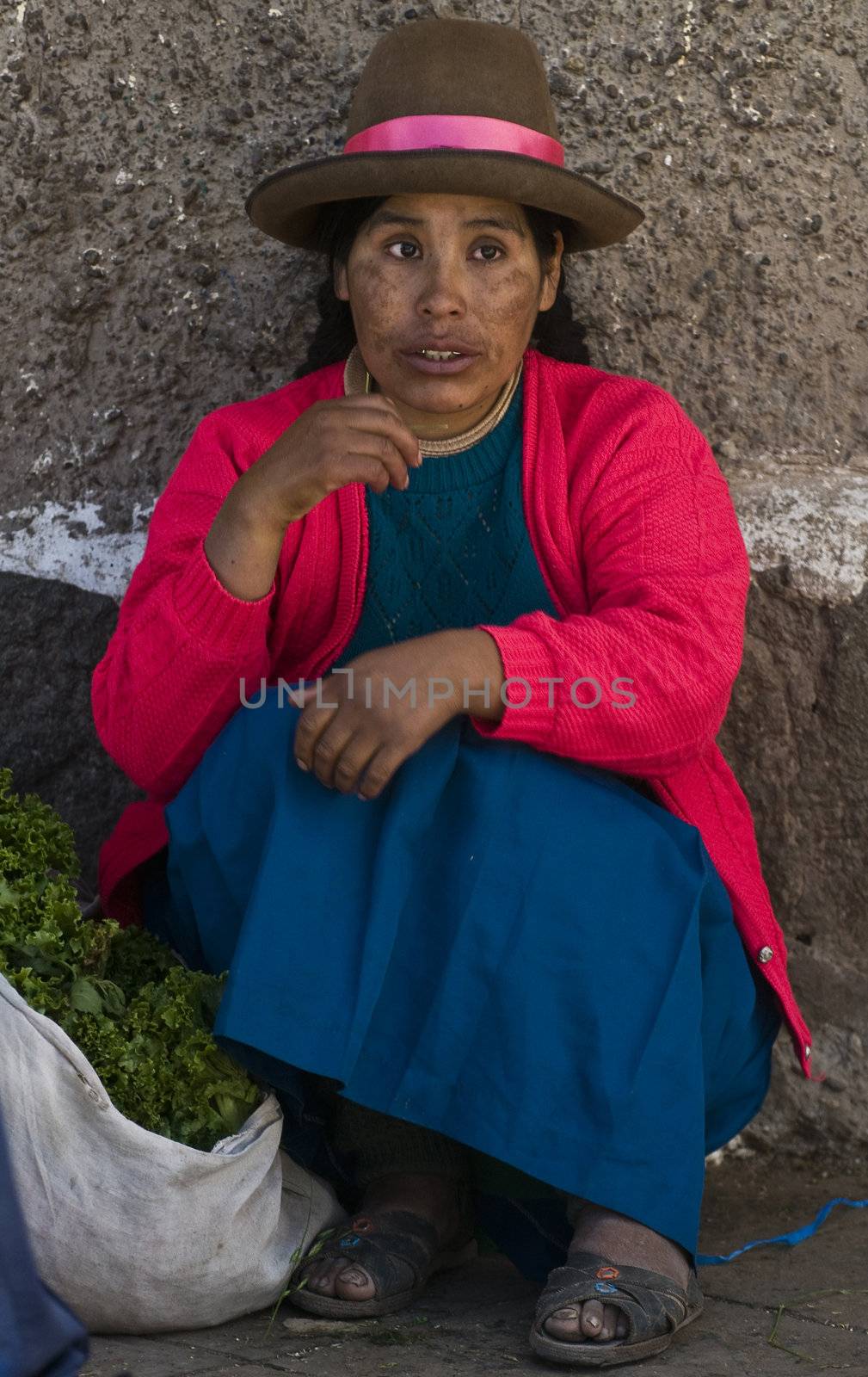 Cusco , Peru - May 27 : Peruvian woman in a market in Cusco Peru , May 27 2011